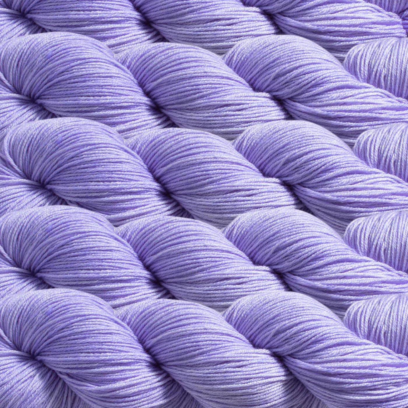 Heritage Yarn in Light Periwinkle (1006), a soft lavender shade with subtle blue undertones. This Superwash Merino and Nylon fingering-weight yarn is perfect for weaving, knitting, and crocheting projects. Offered in 1 lb. cones with 1,996 yards, providing exceptional versatility and creative potential.