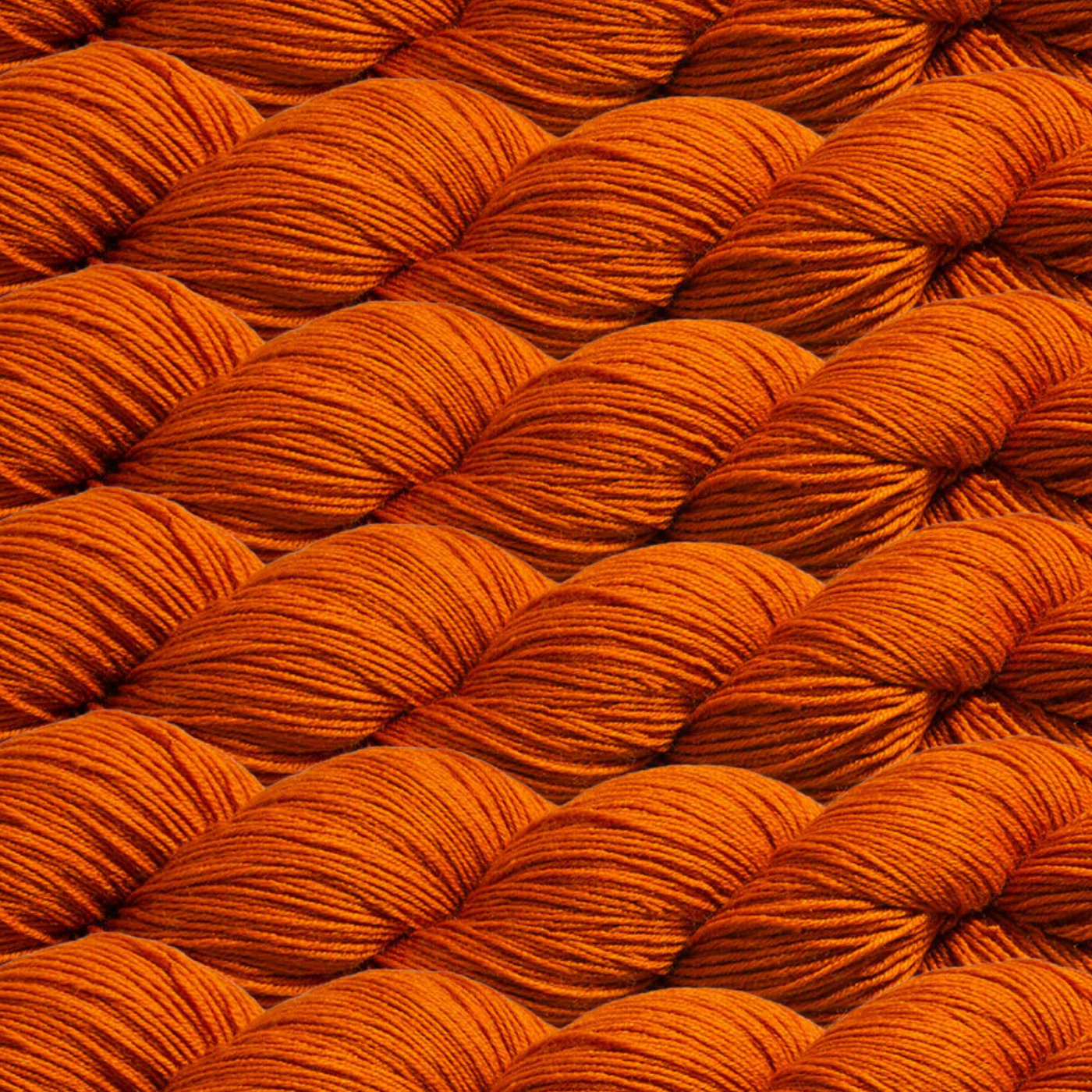 Heritage Yarn in Fire Orange (1027), a bold and fiery shade of orange that exudes warmth and energy. This fingering-weight yarn, crafted from Superwash Merino and Nylon, is durable and vibrant. Perfect for weaving, knitting, and crocheting, with 1 lb. cones offering 1,996 yards for endless creative possibilities.