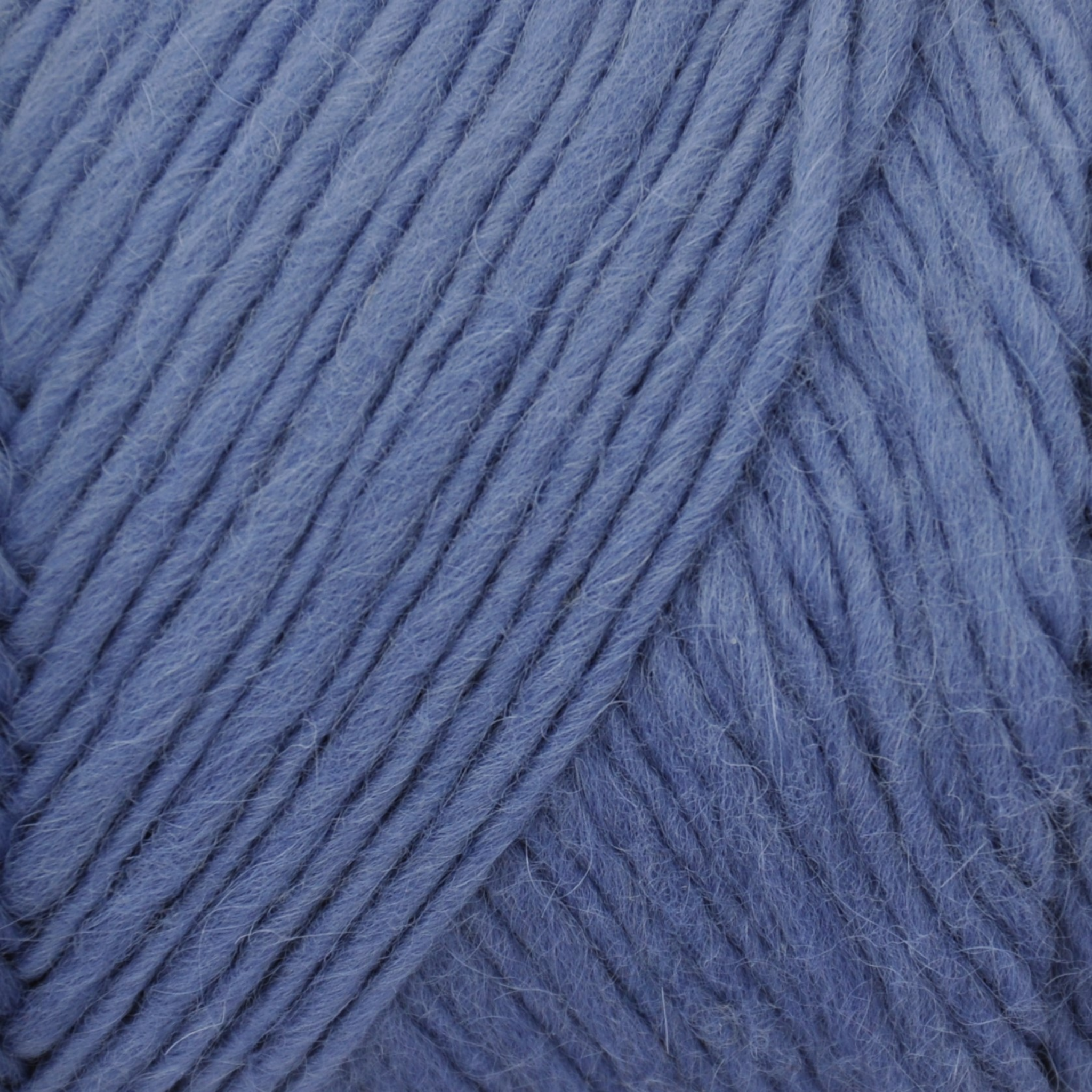 Brown Sheep Lamb’s Pride Worsted wool-mohair yarn close-up in Shiraz Grape dusty denim violet — at Revolution Fibers