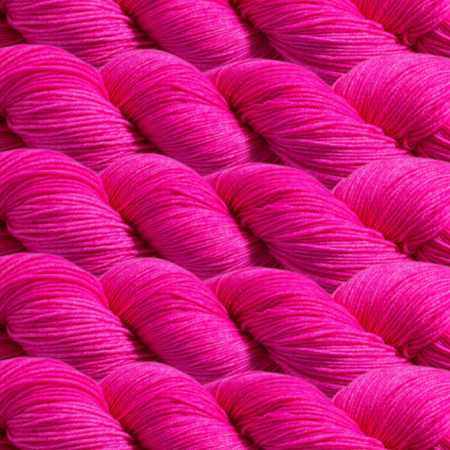 Heritage Yarn in Hot Pink (1003), a bold and vibrant magenta-pink hue. This Superwash Merino and Nylon fingering-weight yarn is perfect for weaving, knitting, and crocheting projects. Offered in 1 lb. cones with 1,996 yards, delivering stunning color and exceptional versatility.