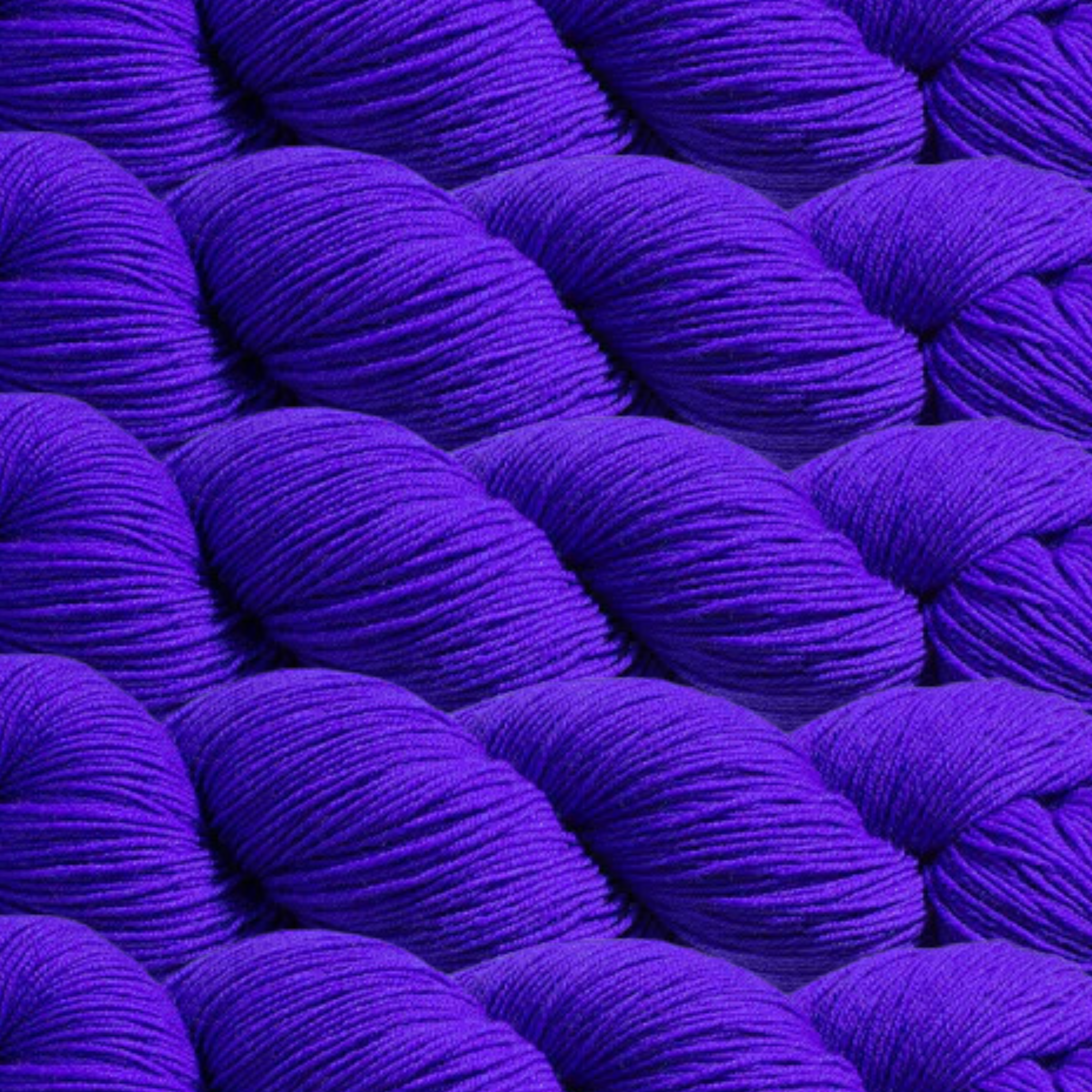 Heritage Yarn in Vivid Violet (1010), a rich, bold purple shade with blue undertones. This Superwash Merino and Nylon fingering-weight yarn is perfect for weaving, knitting, and crocheting vibrant, eye-catching projects. Offered in 1 lb. cones with 1,996 yards, providing excellent versatility and creative freedom.