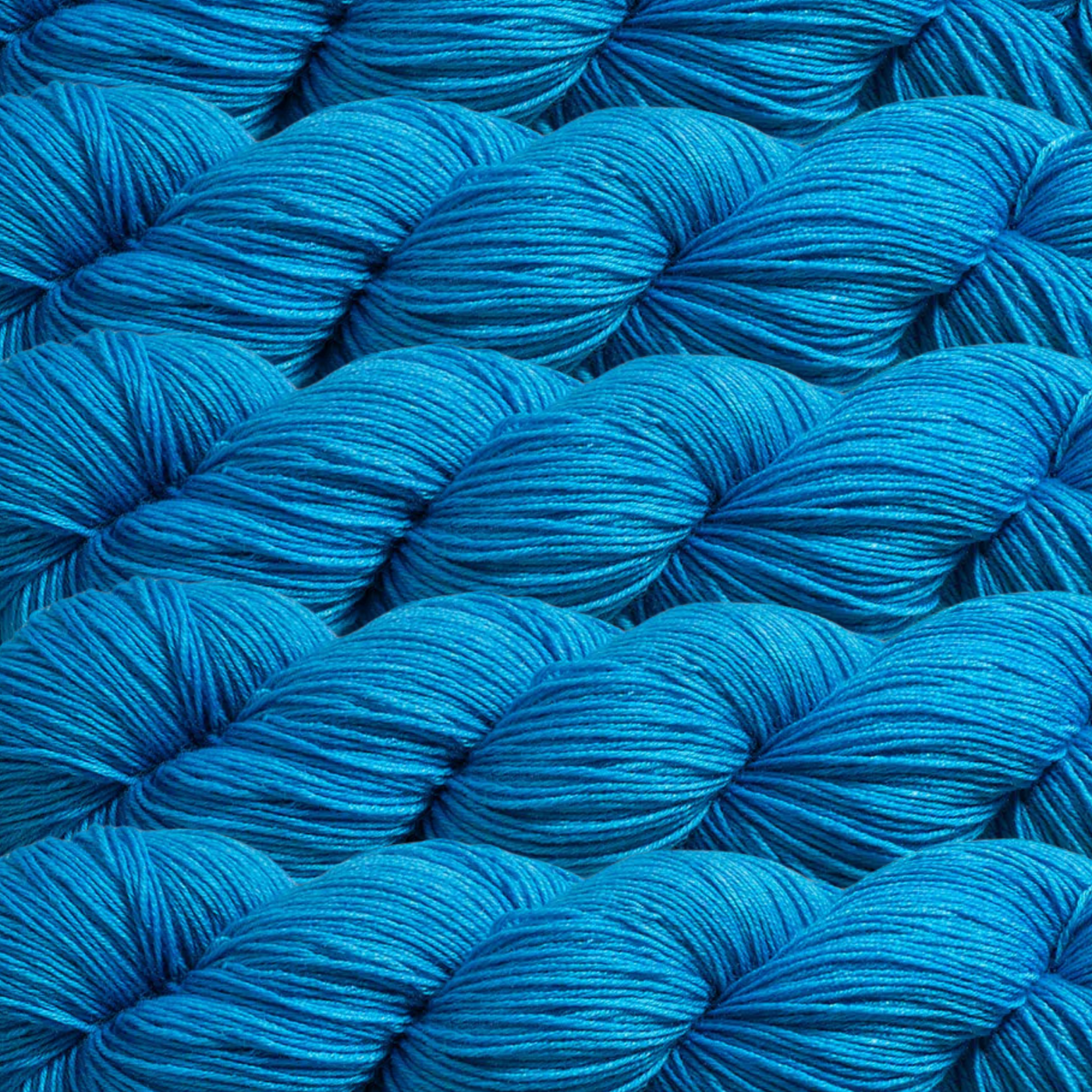 Heritage Yarn in Spanish Blue (1018), a bold and vibrant blue reminiscent of Mediterranean skies. This fingering-weight yarn, crafted from a blend of Superwash Merino and Nylon, is perfect for weaving, knitting, and crocheting. Offered in 1 lb. cones with 1,996 yards, it’s ideal for colorful, lasting creations.