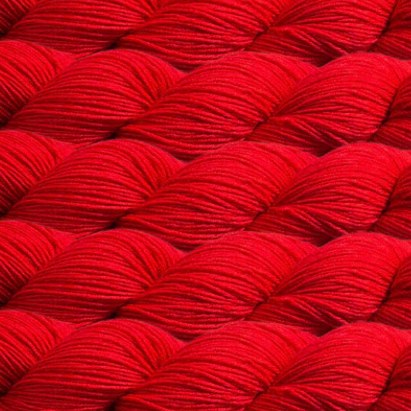 Heritage Yarn in Scarlet Red (1032), a bold and classic red shade that brings intensity and elegance to your projects. This fingering-weight yarn, crafted from Superwash Merino and Nylon, offers durability and a smooth finish. With 1 lb. cones holding 1,996 yards, it's perfect for weaving, knitting, and crocheting timeless creations.