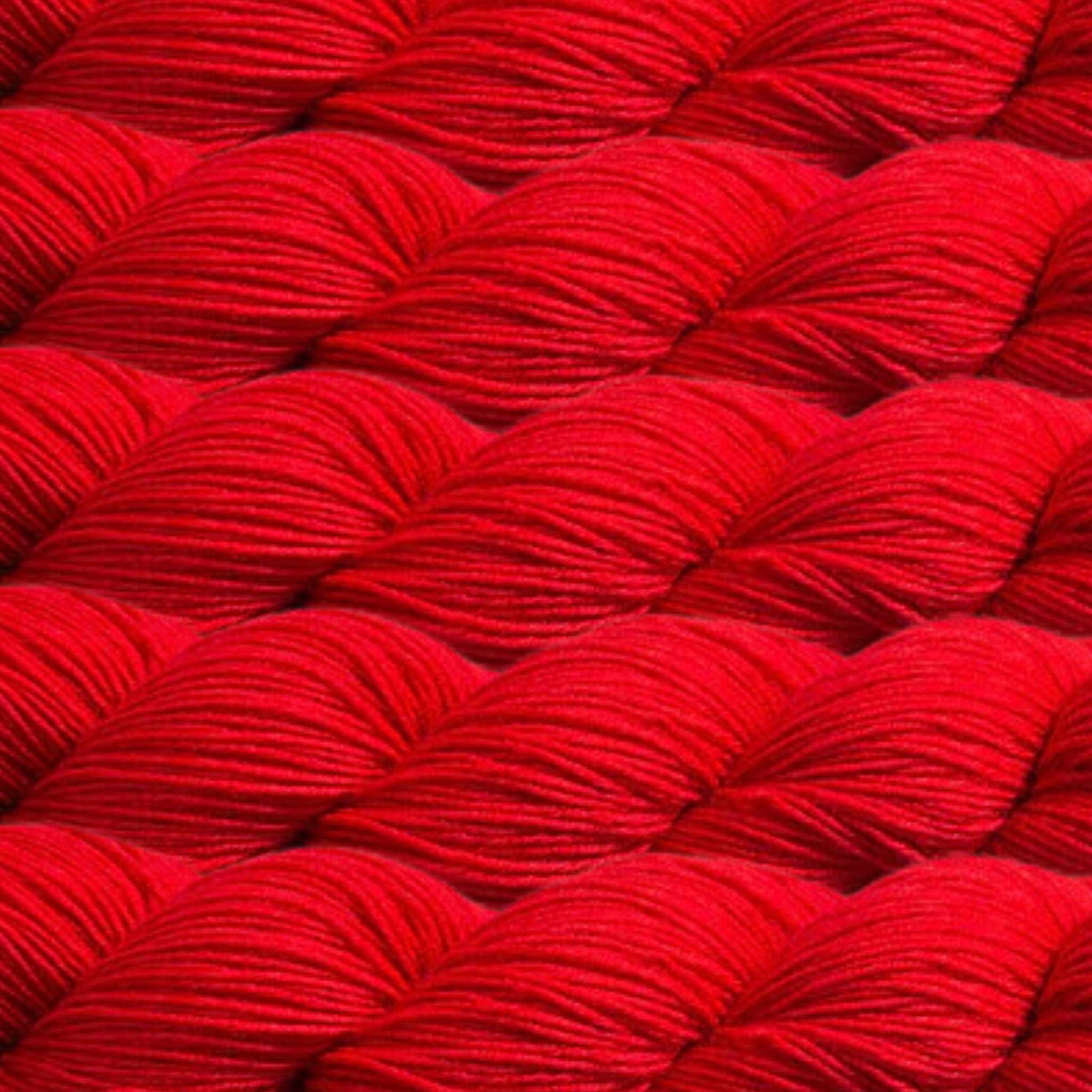 Heritage Yarn in Scarlet Red (1032), a bold and classic red shade that brings intensity and elegance to your projects. This fingering-weight yarn, crafted from Superwash Merino and Nylon, offers durability and a smooth finish. With 1 lb. cones holding 1,996 yards, it's perfect for weaving, knitting, and crocheting timeless creations.