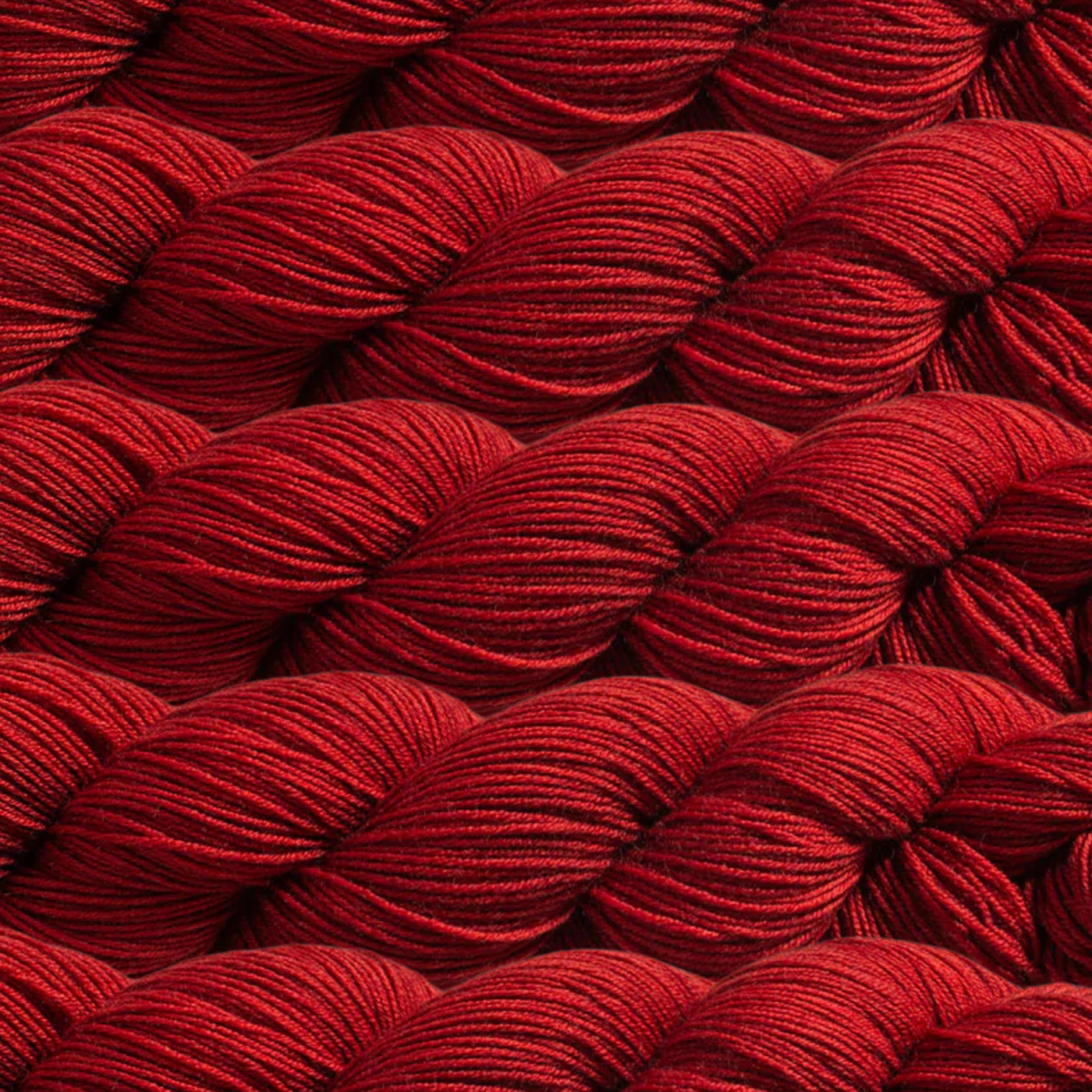 Heritage Yarn in Rustic Red (1049), a warm and earthy red tone perfect for adding depth and richness to your projects. Made from a Superwash Merino and Nylon blend, this fingering-weight yarn is ideal for knitting, crocheting, and weaving. Offered in 1 lb. cones with 1,996 yards for endless creativity.