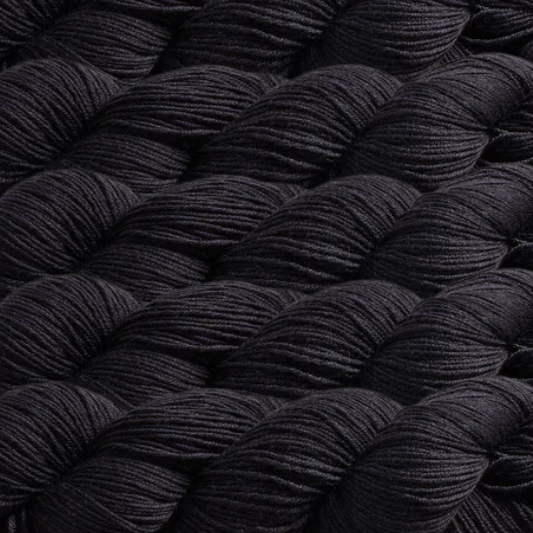 Heritage Yarn in Black, a classic and bold shade perfect for elegant and striking designs. Crafted from a durable Superwash Merino and Nylon blend, this fingering-weight yarn offers softness and strength. Available in 1 lb. cones with 1,996 yards, ideal for knitting, crocheting, and weaving projects.