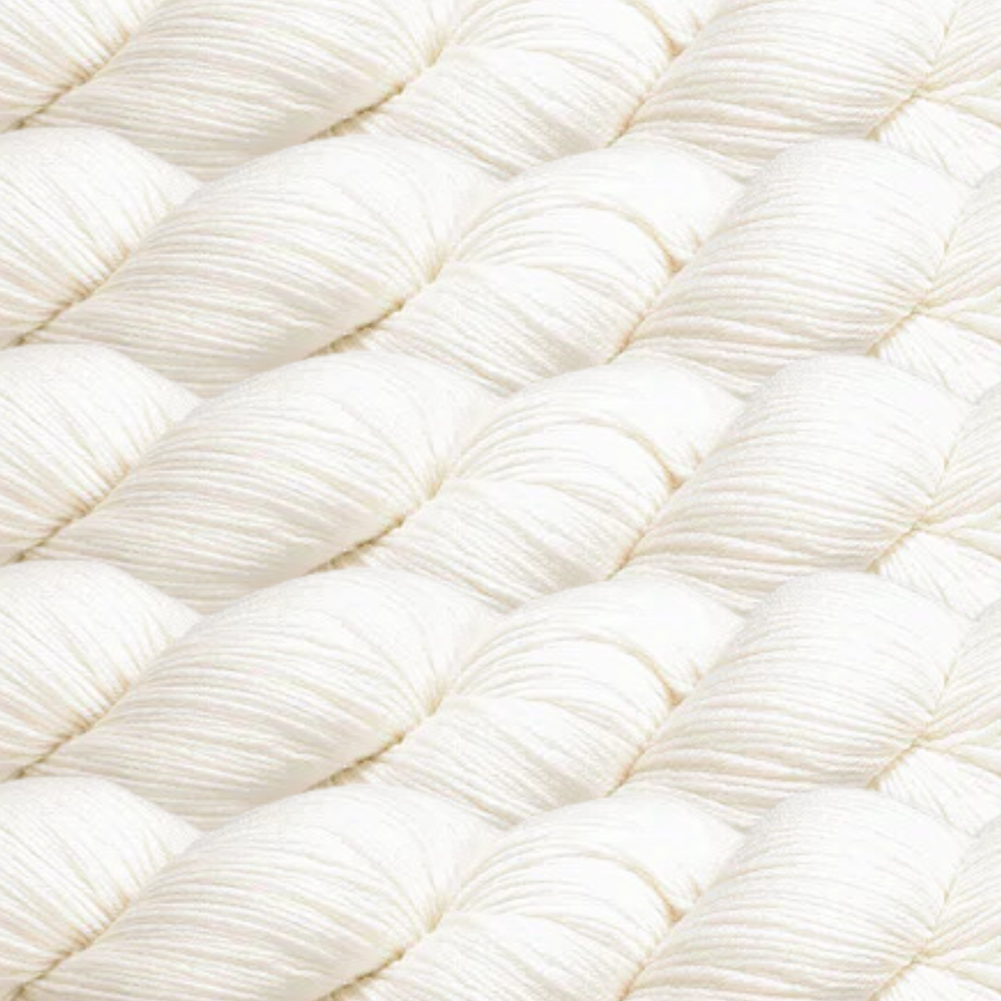 Heritage Yarn in Soft White, a pure and timeless shade perfect for clean, elegant designs. This versatile fingering-weight yarn is crafted from a Superwash Merino and Nylon blend, offering exceptional softness and durability. Available in 1 lb. cones with 1,996 yards, ideal for knitting, crocheting, and weaving projects.