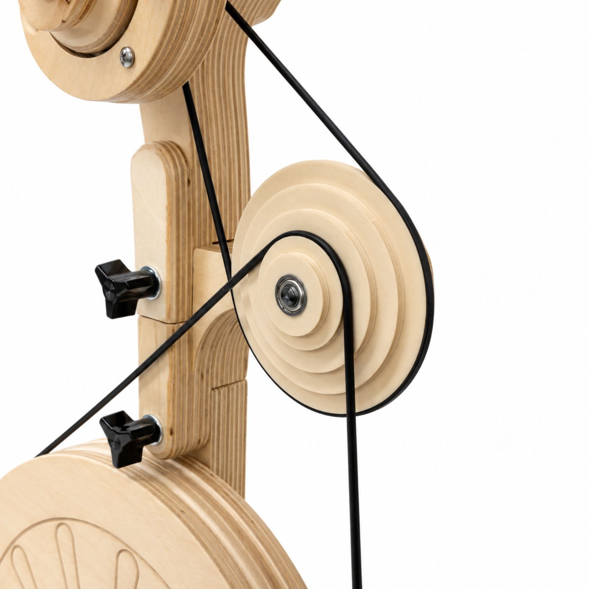 Close-up of the SpinOlution Pollywog spinning wheel drive pulley and black drive band connected to the wooden wheel assembly.