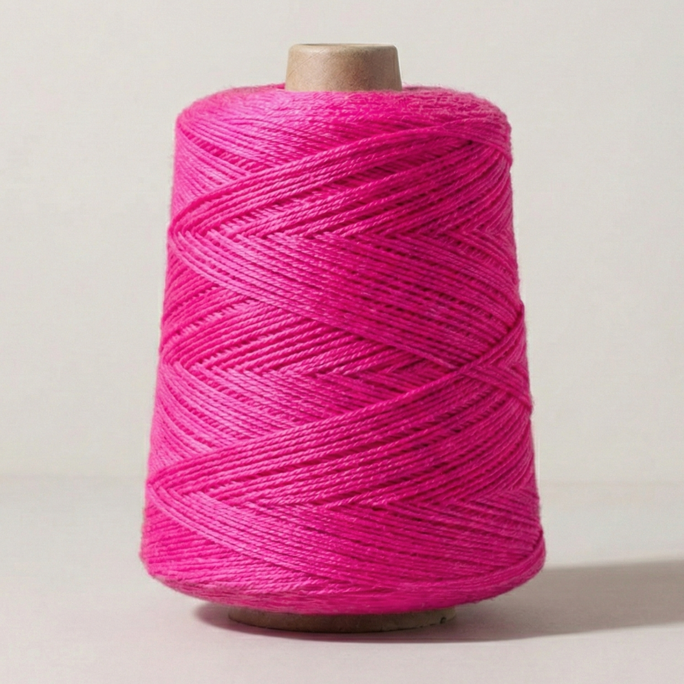 Heritage Yarn in Hot Pink (1003), a bold and vibrant magenta-pink hue. This Superwash Merino and Nylon worsted-weight yarn is perfect for weaving, knitting, and crocheting projects. Offered in 1 lb. cones with 1,000 yards, delivering stunning color and exceptional versatility.