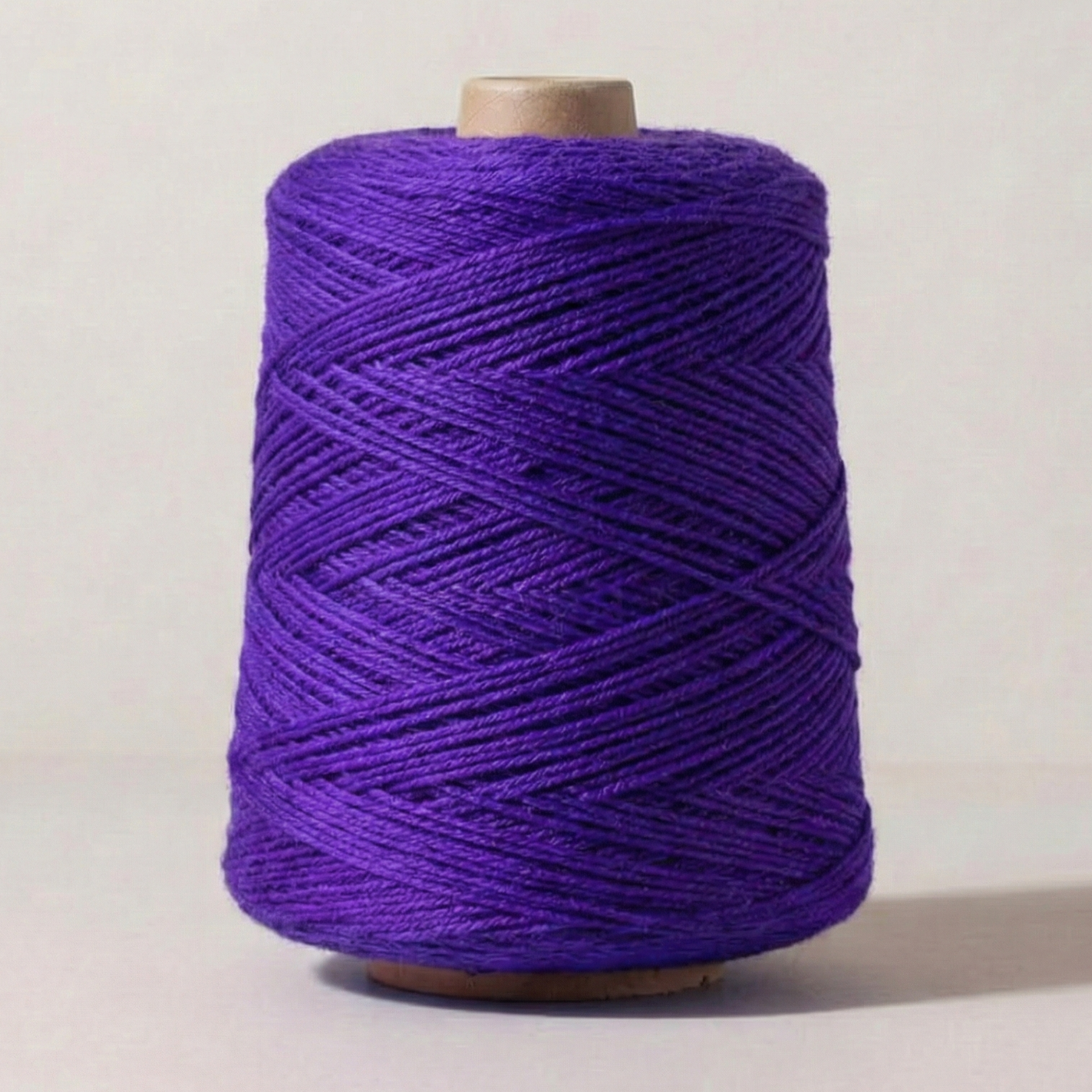 Heritage Yarn in Vivid Violet (1010), a rich, bold purple shade with blue undertones. This Superwash Merino and Nylon worsted-weight yarn is perfect for weaving, knitting, and crocheting vibrant, eye-catching projects. Offered in 1 lb. cones with 1,000 yards, providing excellent versatility and creative freedom.