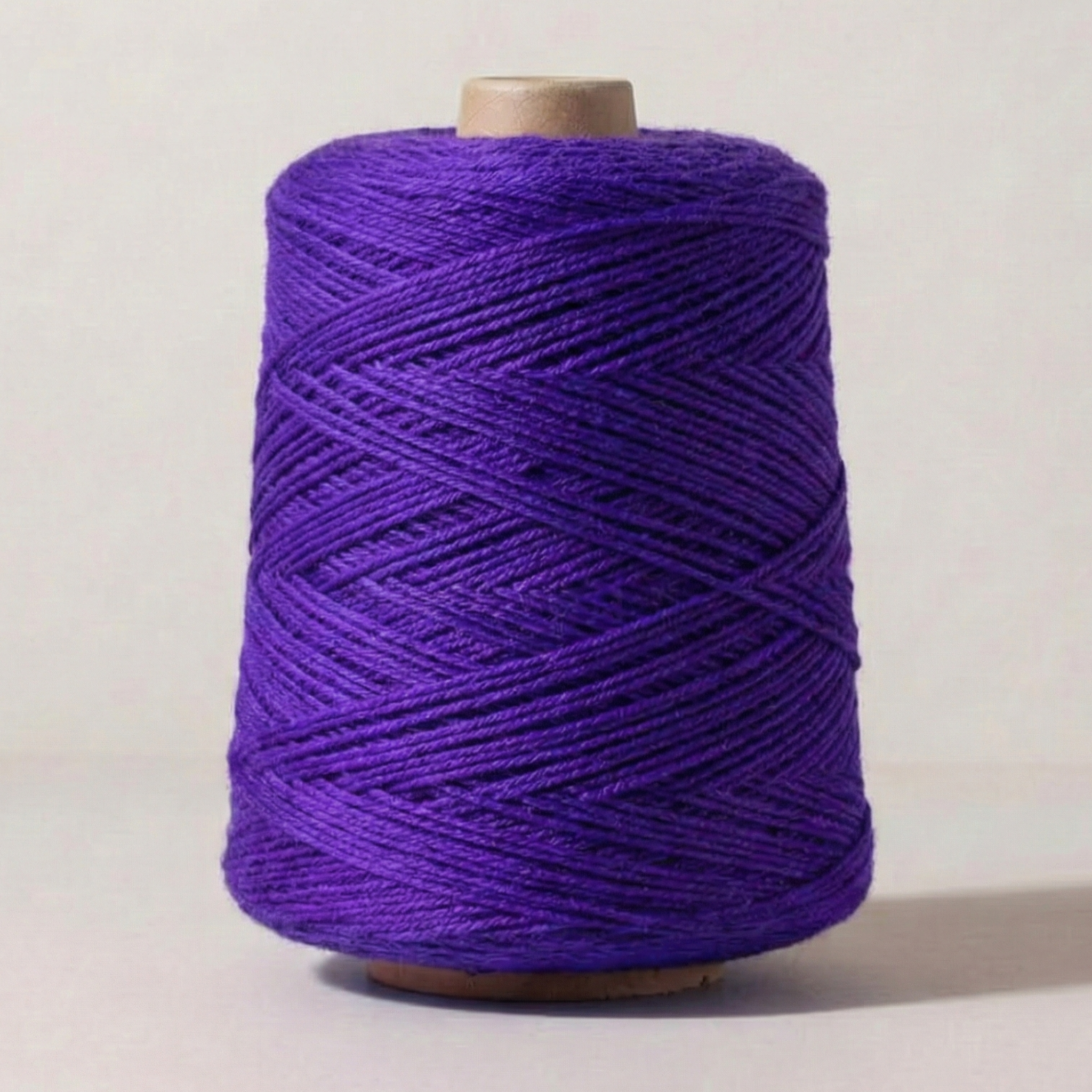 Heritage Yarn in Vivid Violet (1010), a rich, bold purple shade with blue undertones. This Superwash Merino and Nylon worsted-weight yarn is perfect for weaving, knitting, and crocheting vibrant, eye-catching projects. Offered in 1 lb. cones with 1,000 yards, providing excellent versatility and creative freedom.