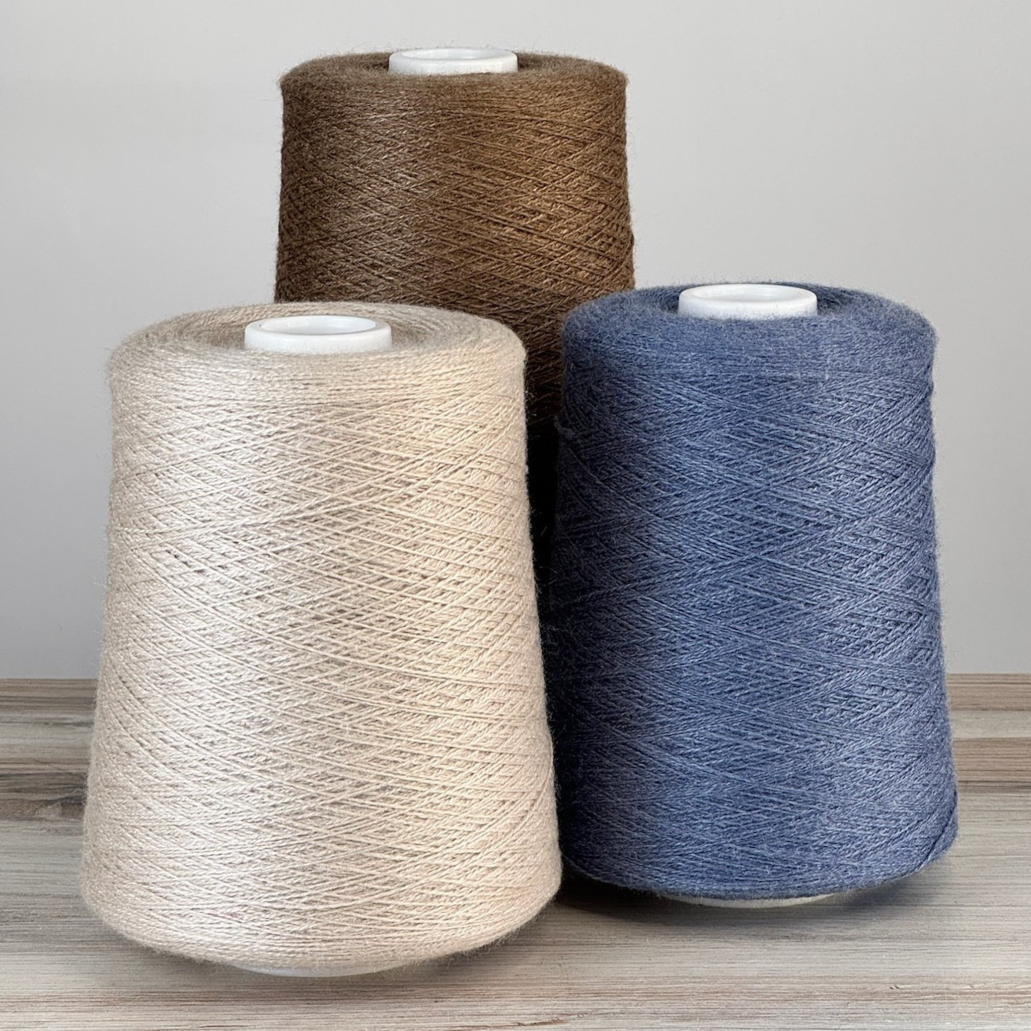 Mushroom, espresso, and indigo cones in a calm neutral palette; 1 lb. cones, 2/18 lace (4455 yards), smooth twist for elegant yardage.