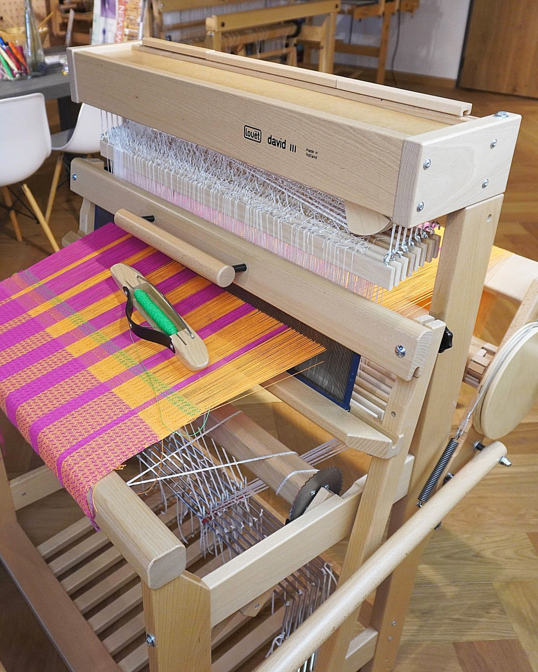 A compact 8-shaft loom that weaves like a dream—and can easily keep up with much larger floor looms.

Made from lacquered beech wood, it comes complete with:

• Stainless steel reed (40-10 metric)
• 800 Texsolv heddles (280 mm)
• 2 tie-up stick
• 2 lease sticks
• 16 warp sticks