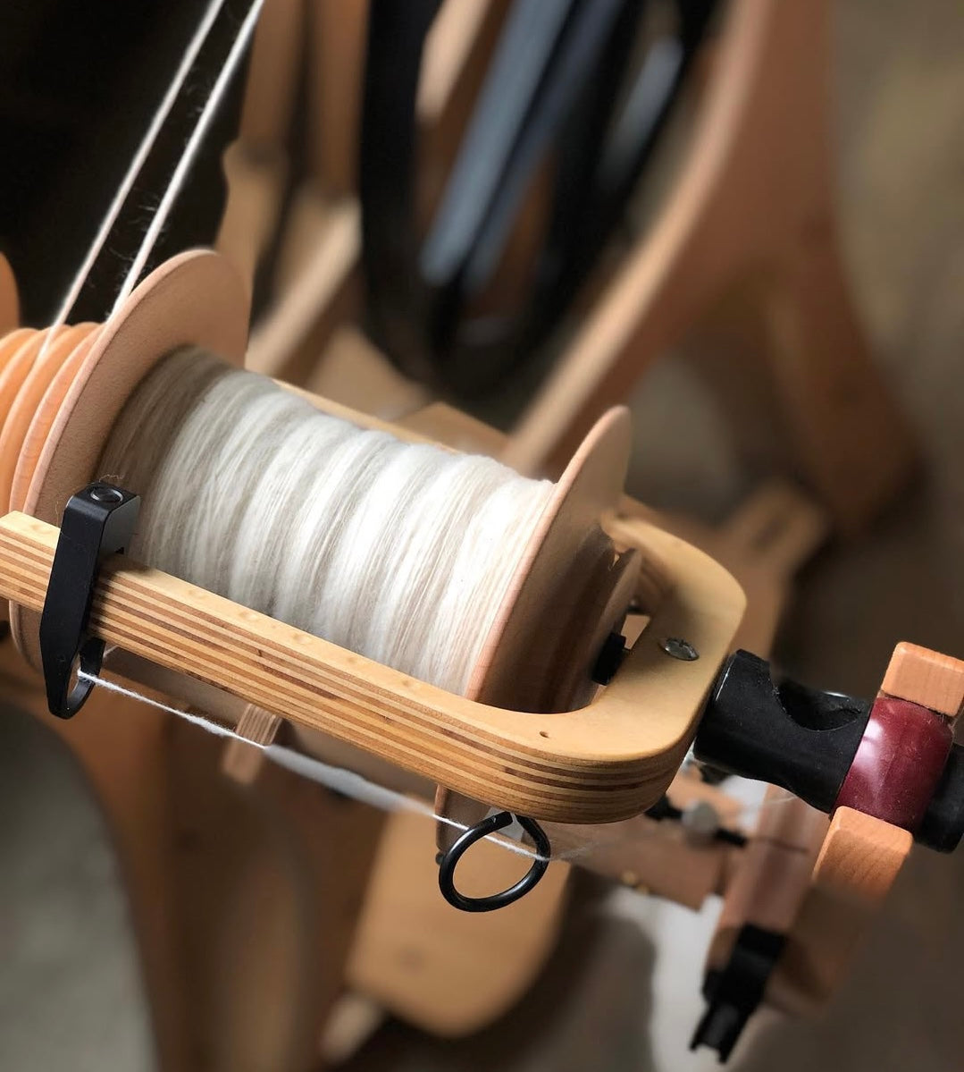 Spinning natural Polwarth wool top on the Schacht Flatiron Spinning Wheel