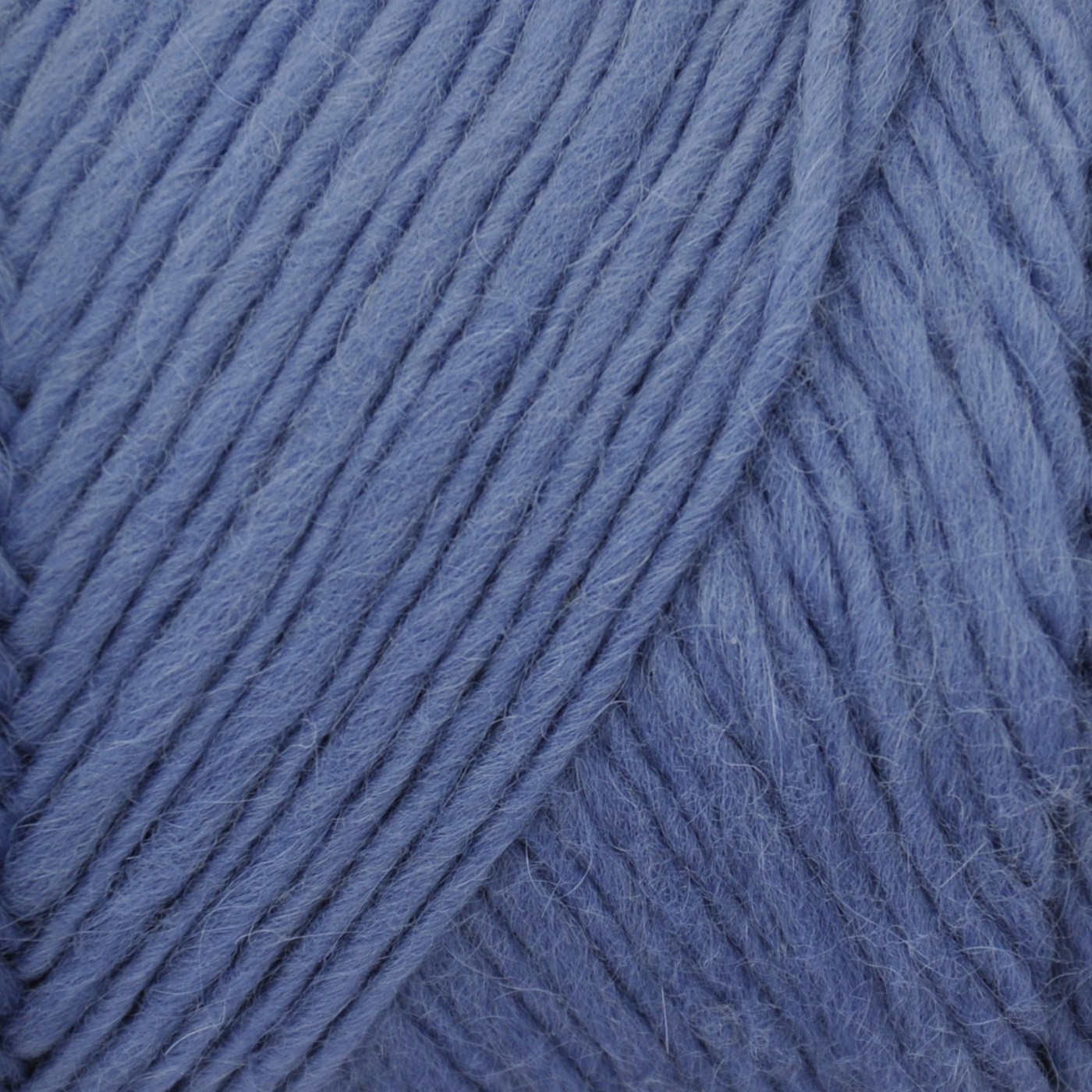 Brown Sheep Lamb’s Pride Worsted wool-mohair yarn close-up in Shiraz Grape dusty denim violet — at Revolution Fibers