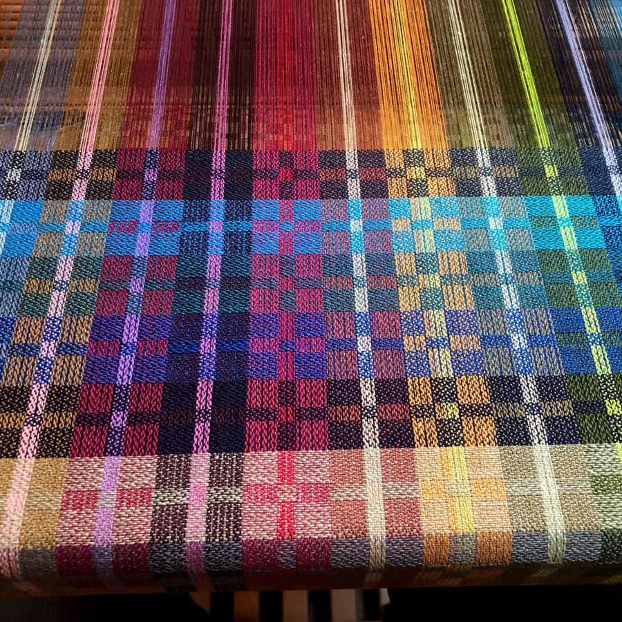 Woven sample of Euroflax 14/4 Linen Yarn showcasing full color range in a plaid pattern. Ideal for visualizing color combinations and sett options in weaving projects using 100% long-line Belgian flax yarn.