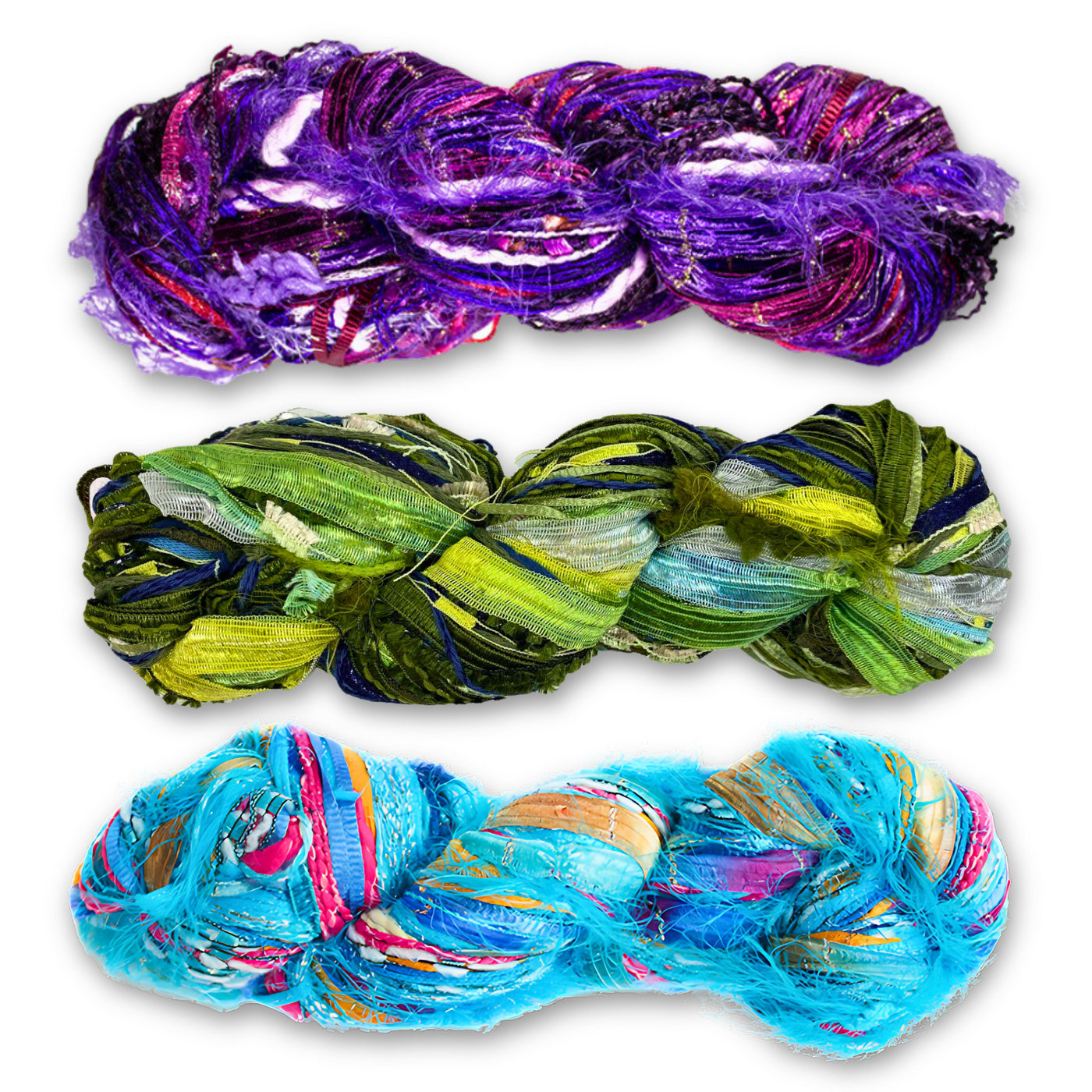 Three vibrant skeins of Feza Alp Premier Yarn showcasing multi-texture and bold colors. Top skein is 'Eclipse Ember' (Color Number 24) with purples and pinks, middle skein is 'Aurora Drift' (Color Number 29) with greens and blues, and bottom skein is 'Celestial Tide' (Color Number 403) with bright blues and multicolor accents.