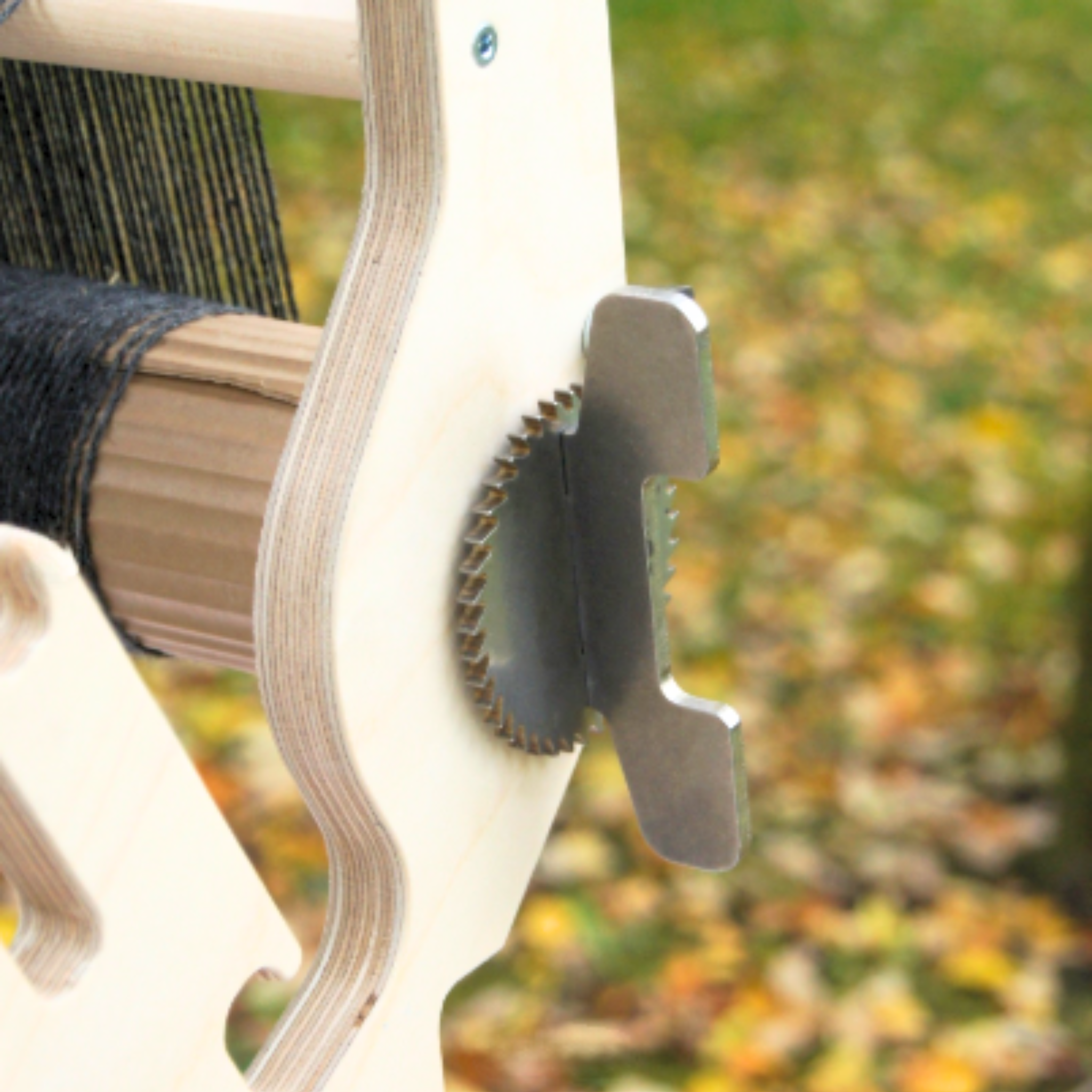 Close-up of the Glimakra Siru Rigid Heddle Loom's heavy-duty stainless steel ratchet and pawl system, designed for precise tension control and secure weaving. This durable mechanism ensures a smooth and stable weaving experience, even under high warp tension.