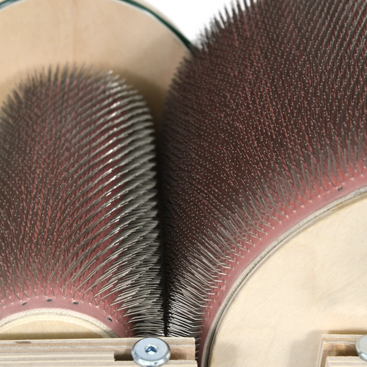 Close-up of the fine 120 TPI carding cloth on the Golden Fleece drum carder's main drum and licker-in.