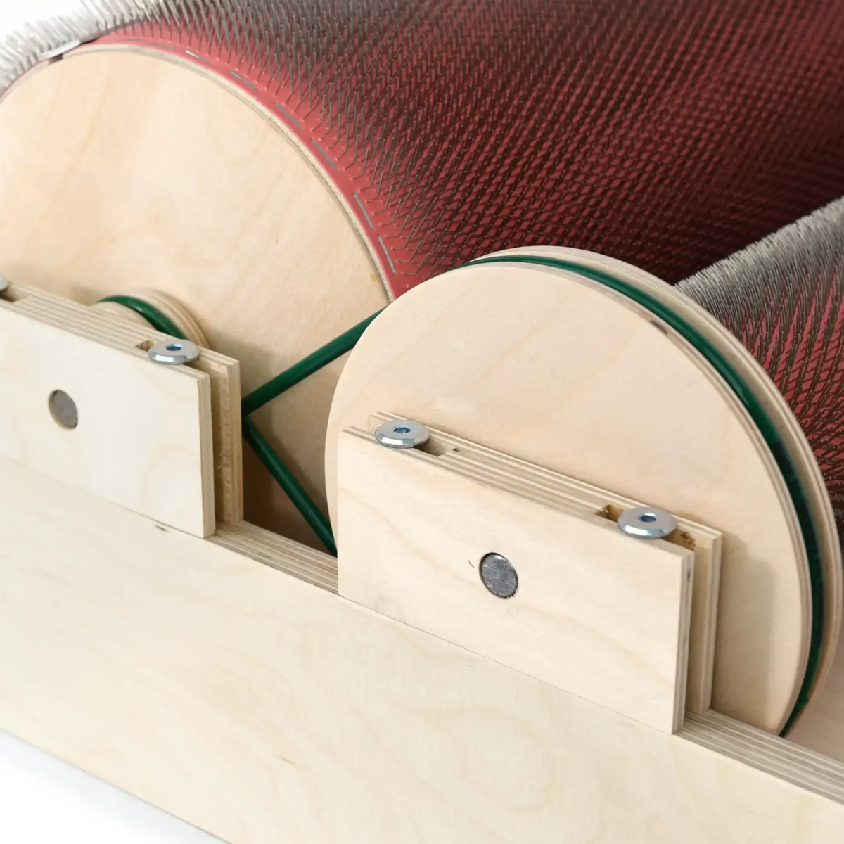Belt-side view of the Golden Fleece WIDE 120 TPI drum carder showing the wooden drum ends and drive belt.