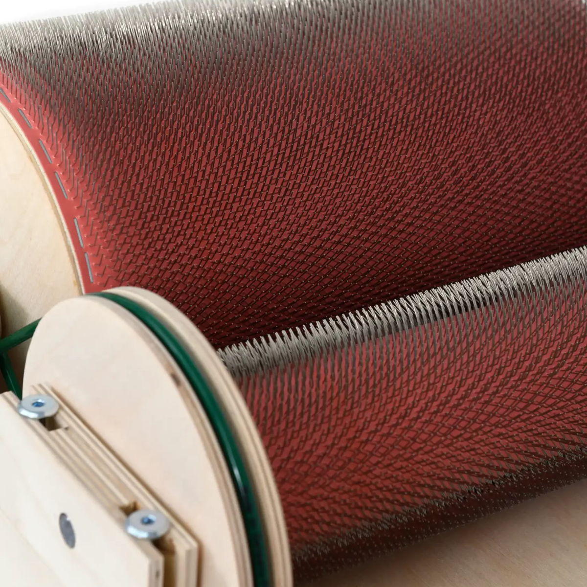 Close-up of the Golden Fleece WIDE 120 TPI main drum showing the dense fine carding cloth and wooden drum end.