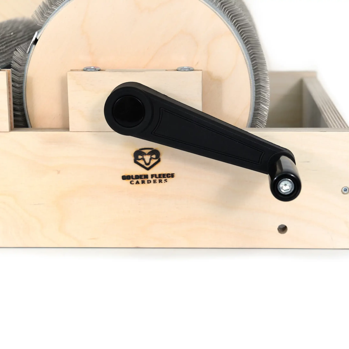 Close-up of the Golden Fleece WIDE 54 TPI drum carder's black hand crank and wooden main drum end.