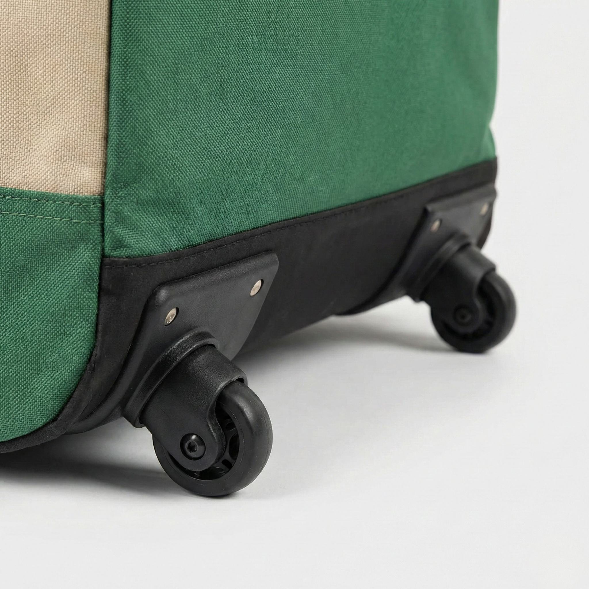 Rolling wheels and reinforced base detail on Kromski Minstrel spinning wheel bag—durable travel-ready construction.