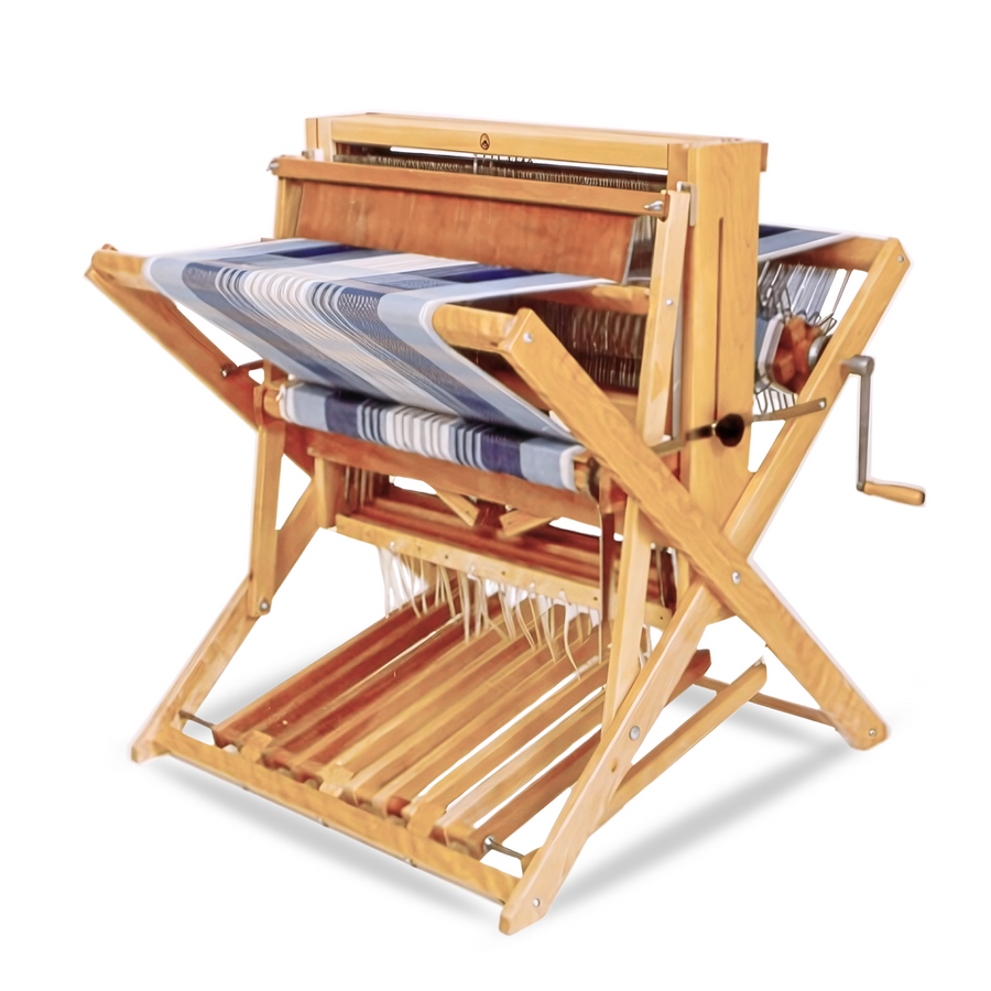 Leclerc Compact Floor Loom set up for weaving with a project in progress. A sturdy, jack-type floor loom with a smooth beater, multiple treadles, and a compact design for small spaces and workshops.