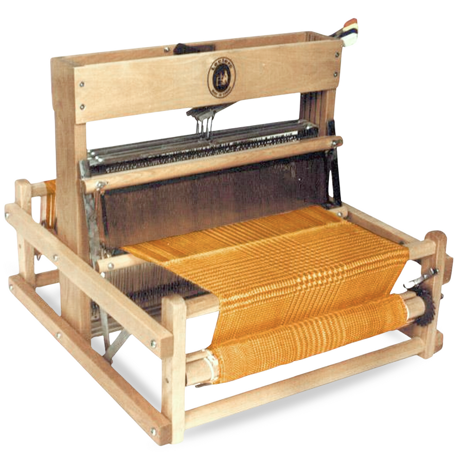 Leclerc Dorothy Table Loom – a compact, foldable weaving loom made from solid maple. Shown with an active warp, this portable 4-shaft table loom is ideal for beginner weavers, workshops, and sampling projects.