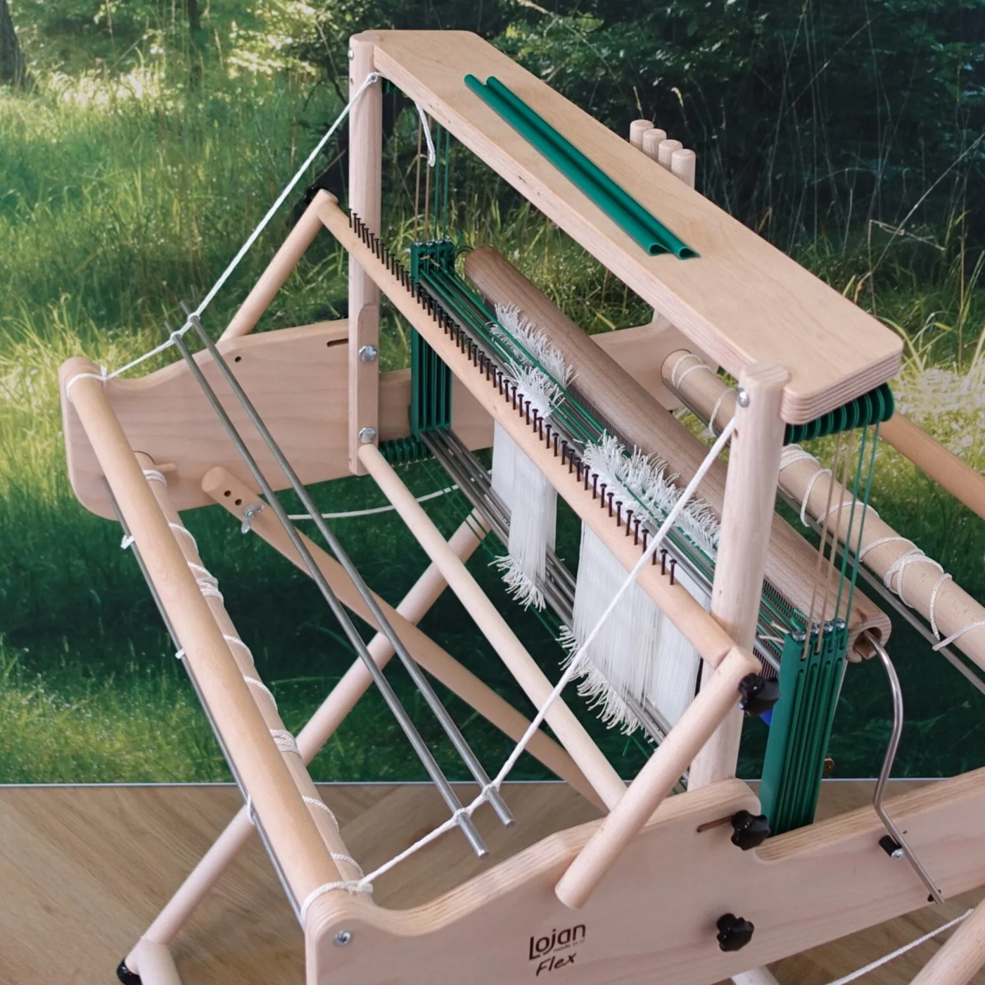 Top view of the Lojan Raddle Flex showing evenly spaced raddle dents and cover strip that secures warp while beaming.