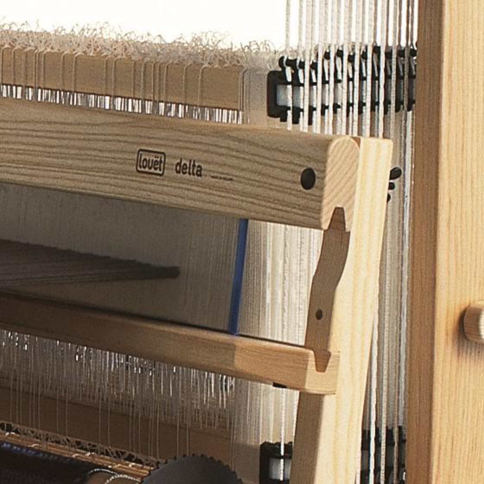Louët Delta Floor Loom close-up of beater and patented floating breast beam tension system