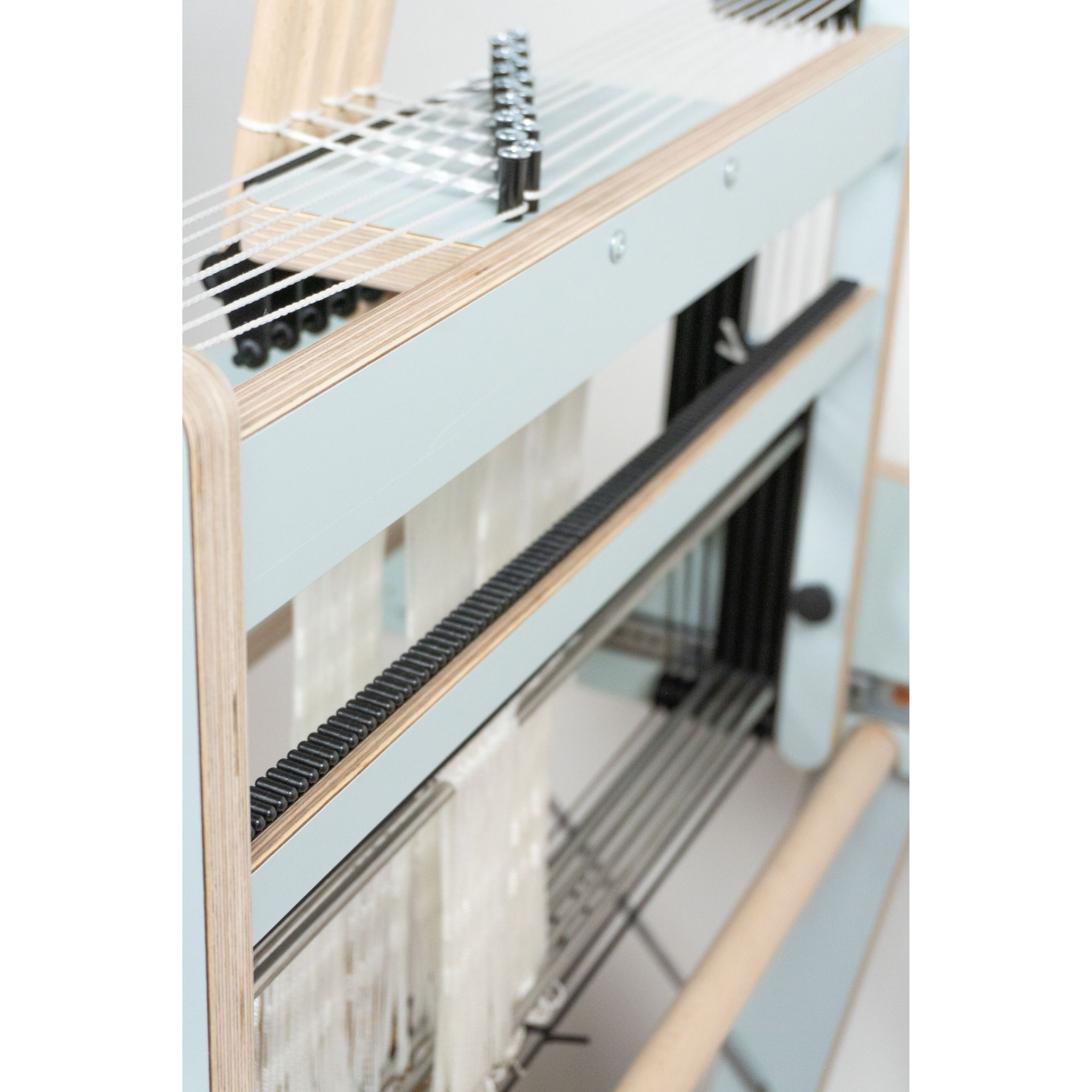 Louet Harmony Loom Light Blue – Side view of castle, raddle, and reed area