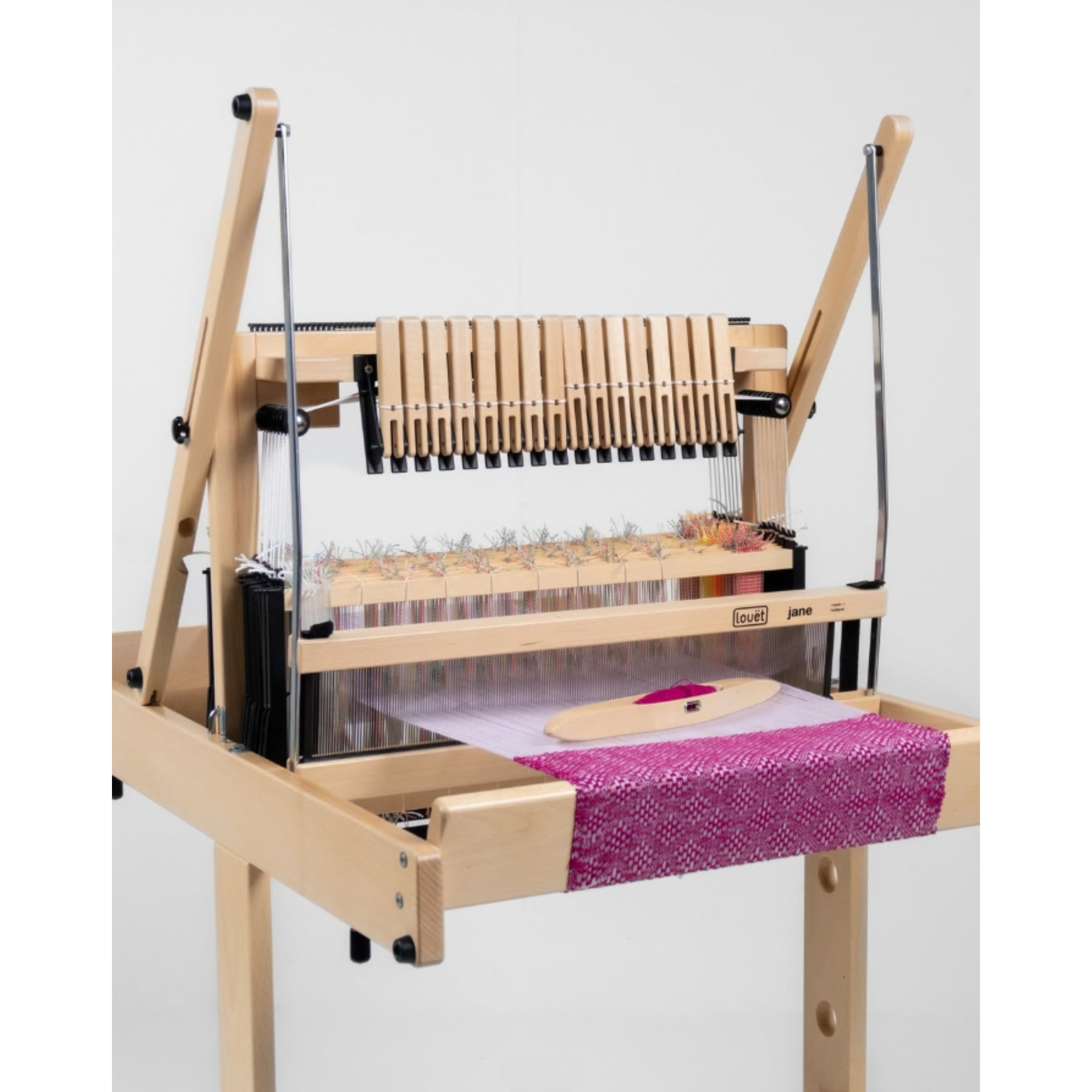 Louët Jane 16‑shaft loom fully upright, highlighting foldable frame and lightweight portability.