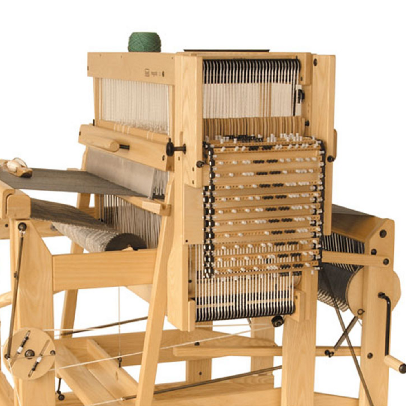 Louet Megado dobby loom with treadle height adjusting kit installed, showing ergonomic treadle setup and heddle system for advanced weaving control