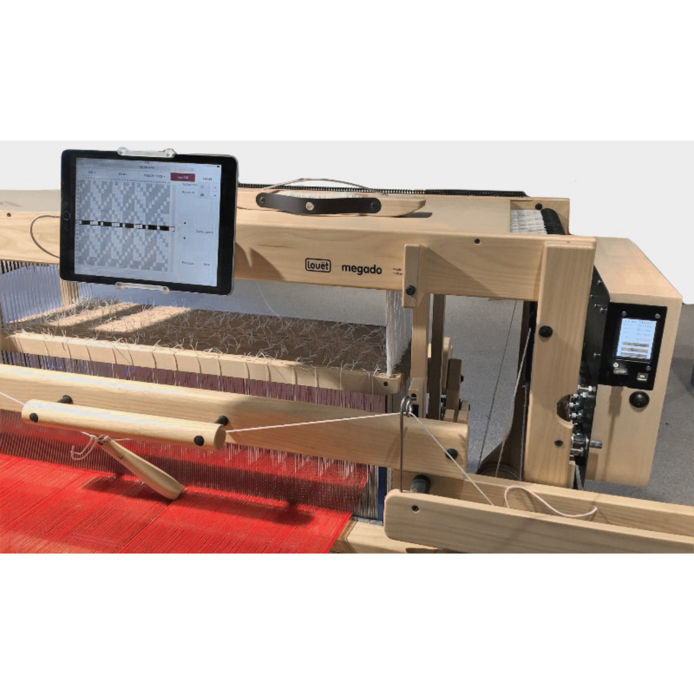 Louet Megado V2 Electronic Dobby Head connected to tablet showing weave draft on loom.