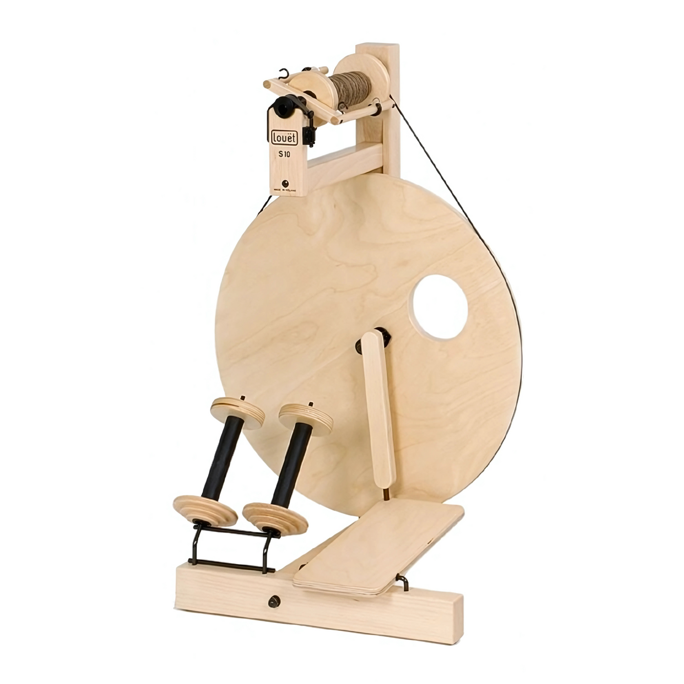Front view of Louet S10 Single Treadle Spinning Wheel with included bobbins on lazy kate, showcasing the classic Irish tension system and large drive wheel.