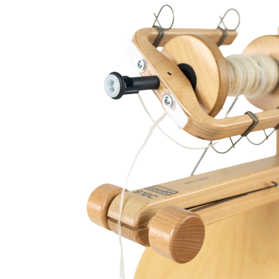 Updated scotch tension sliding flyer on the Louët S10 Concept spinning wheel close up.