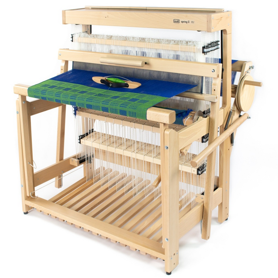 Louët Spring II countermarch floor loom shown threaded with a blue–green warp, full three‑quarter front view