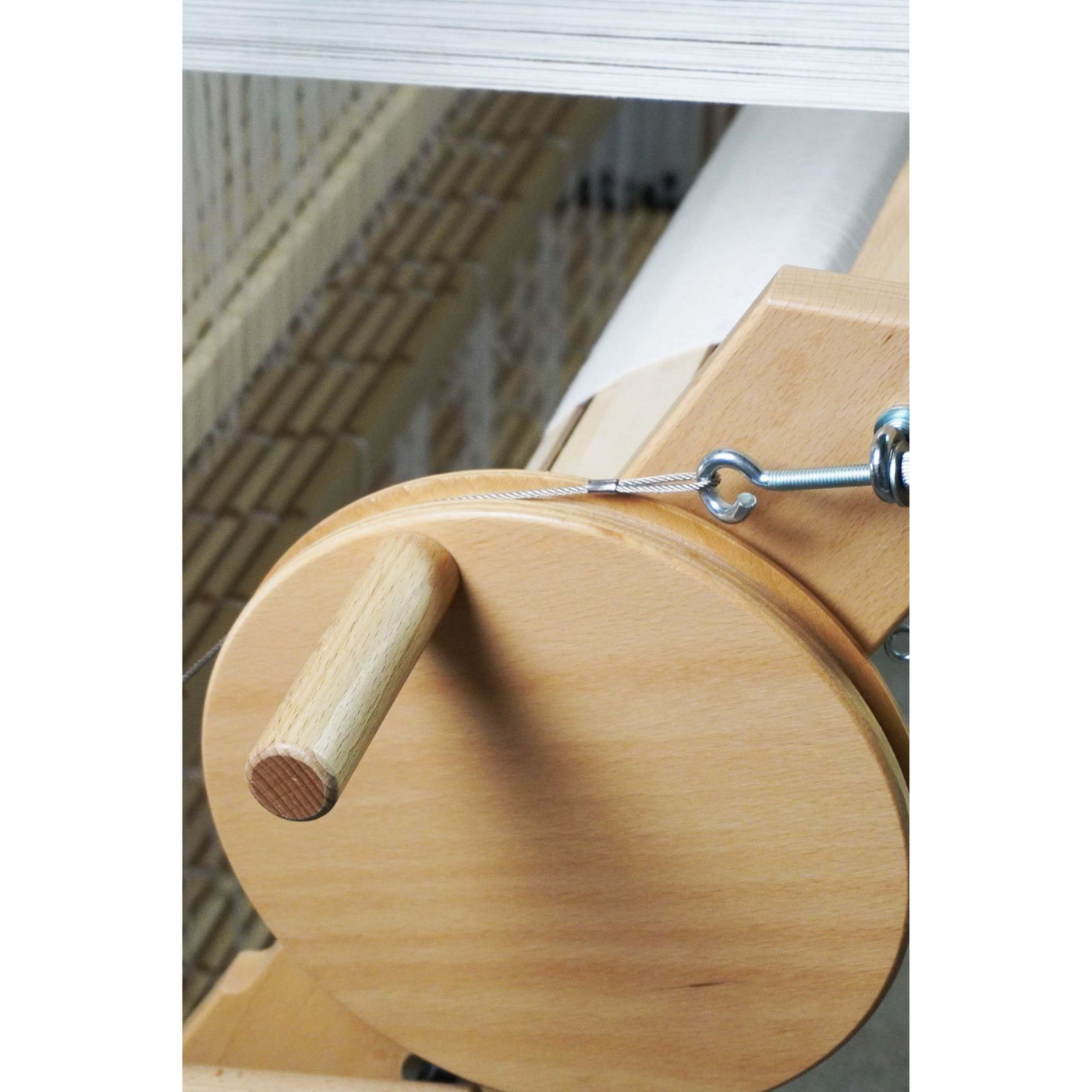 Spring II back beam with friction brake drum and wooden crank for precise warp tension control