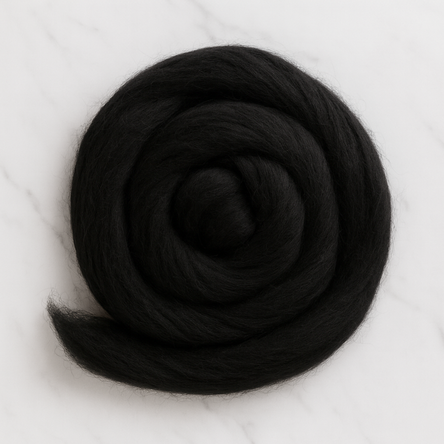 19 Micron Black Carded Merino Wool Sliver – Rolled Bundle on White Marble Background