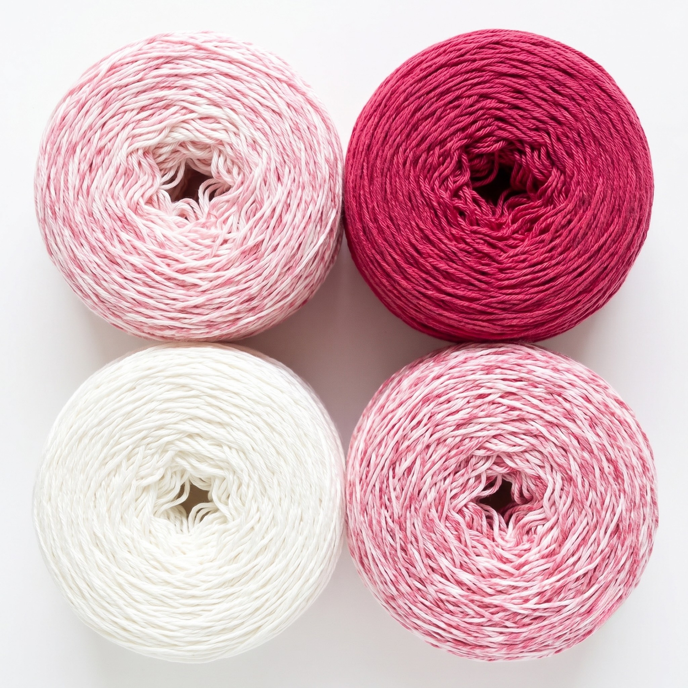 Revolution Fibers Baby Bloom Gradient Baby Blanket Kit Rose Dust yarn cakes shown from above in a 2x2 grid.