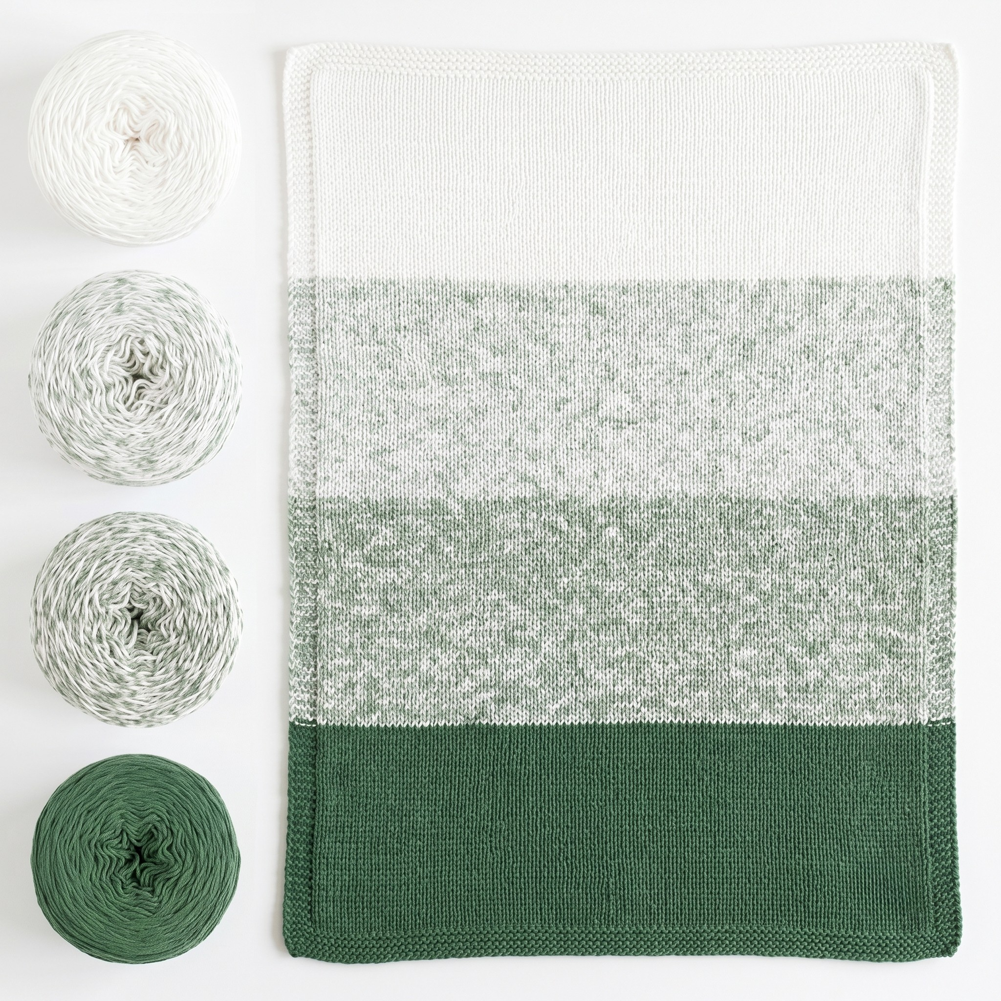 Revolution Fibers Baby Bloom Spring Leaf baby blanket kit with matching green yarn cakes and finished knit blanket.