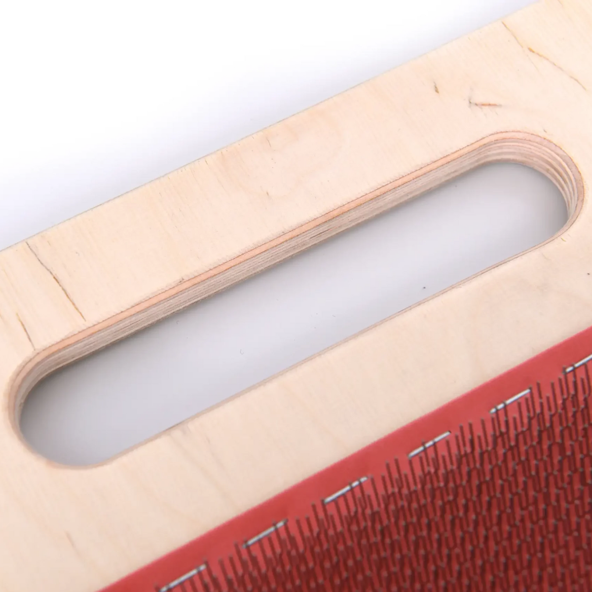 Close-up of the carry handle and wooden construction of the Revolution Fibers 108 TPI Blending Board.