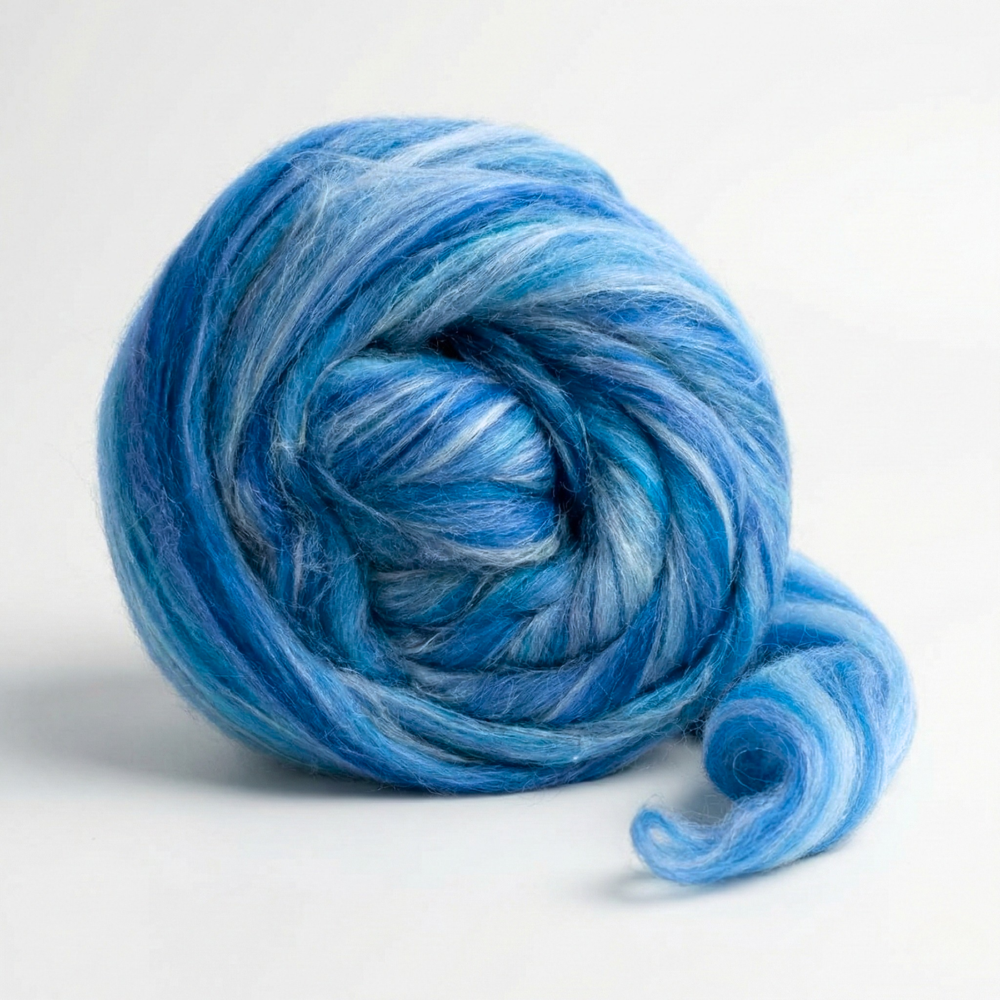 Aquila Blue Constellation Range roving, 8 oz 70% dyed merino and 30% tussah silk (21 micron), studio swirl on white background.