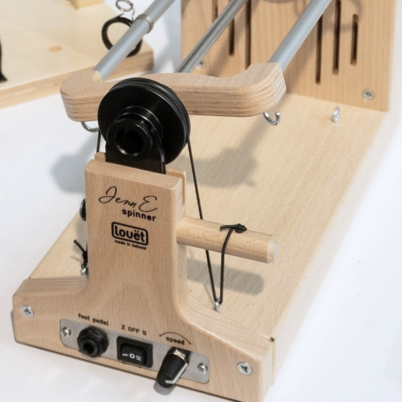 Close-up of the Louet Jenn E e-spinner’s flyer, tension knob, and variable-speed power panel.
