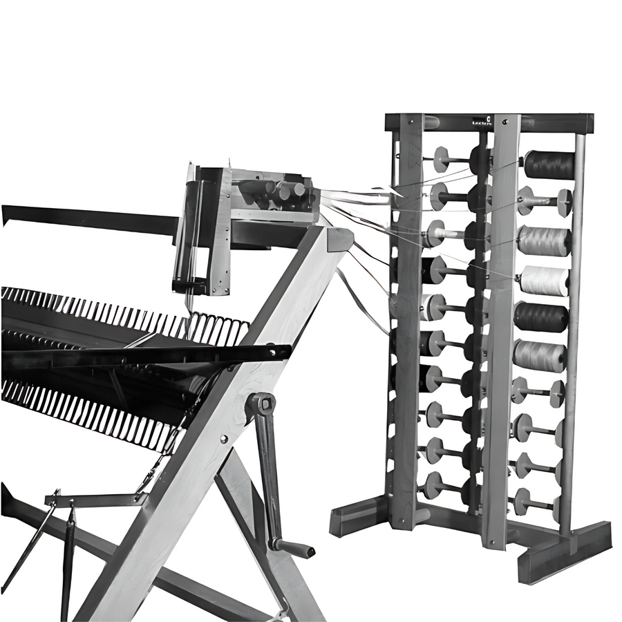 Sectional warp beam in use on Leclerc loom with tension box and spool rack.