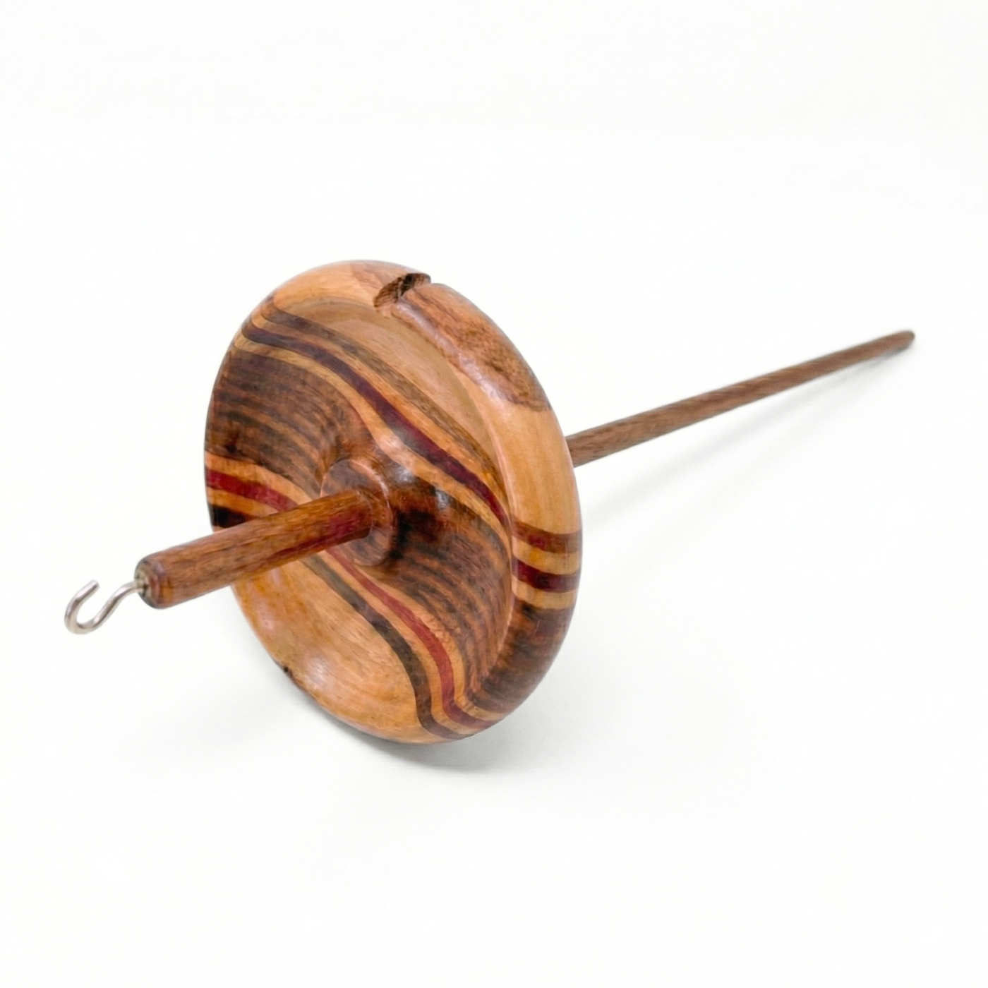 Revolution Fibers top whorl drop spindle with multi-wood wavy whorl and metal hook, studio photo on pure white background