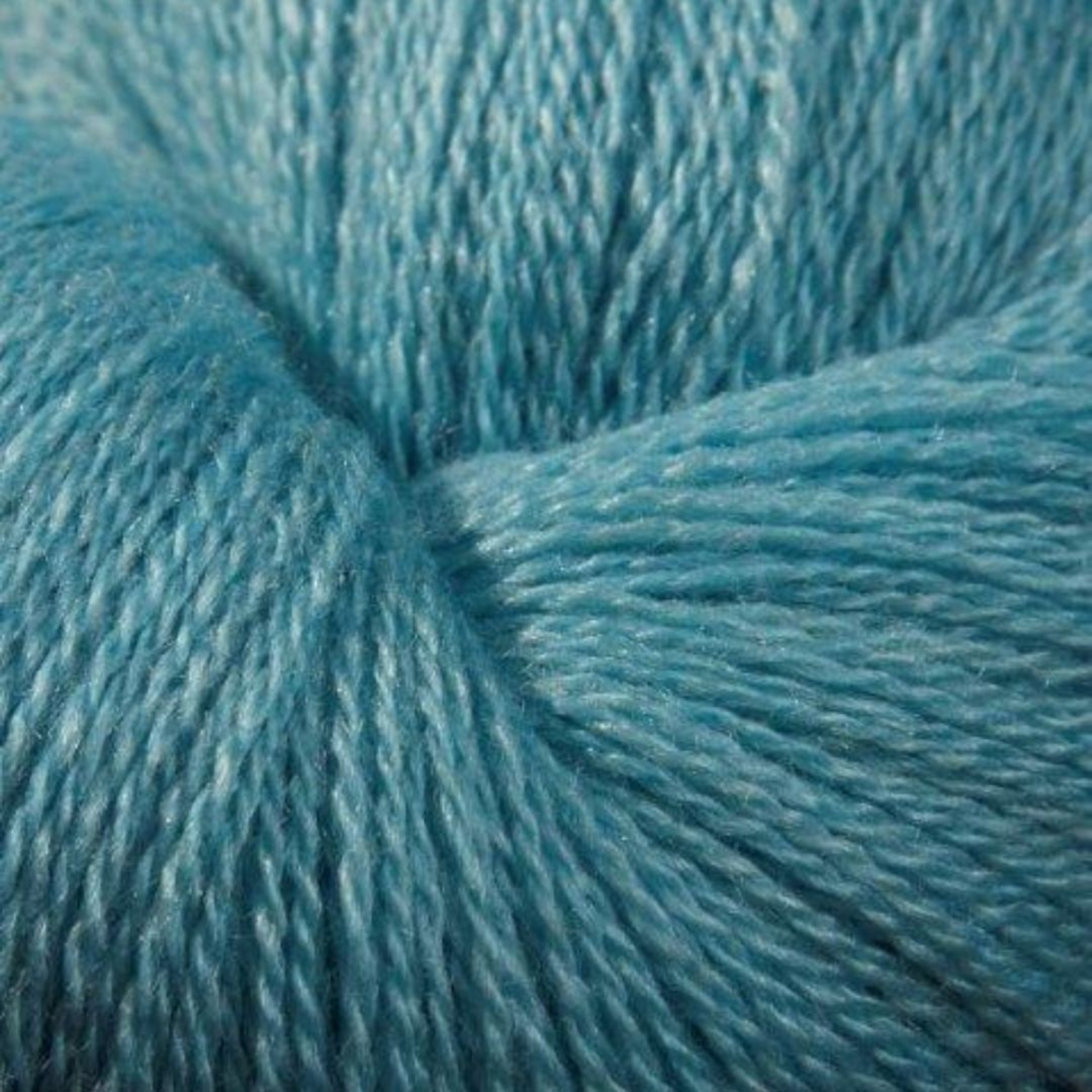 Zephira 2/18 wool-silk lace cone in Teal; clear blue-green, smooth worsted finish, 1 lb approx 5,040 yards.