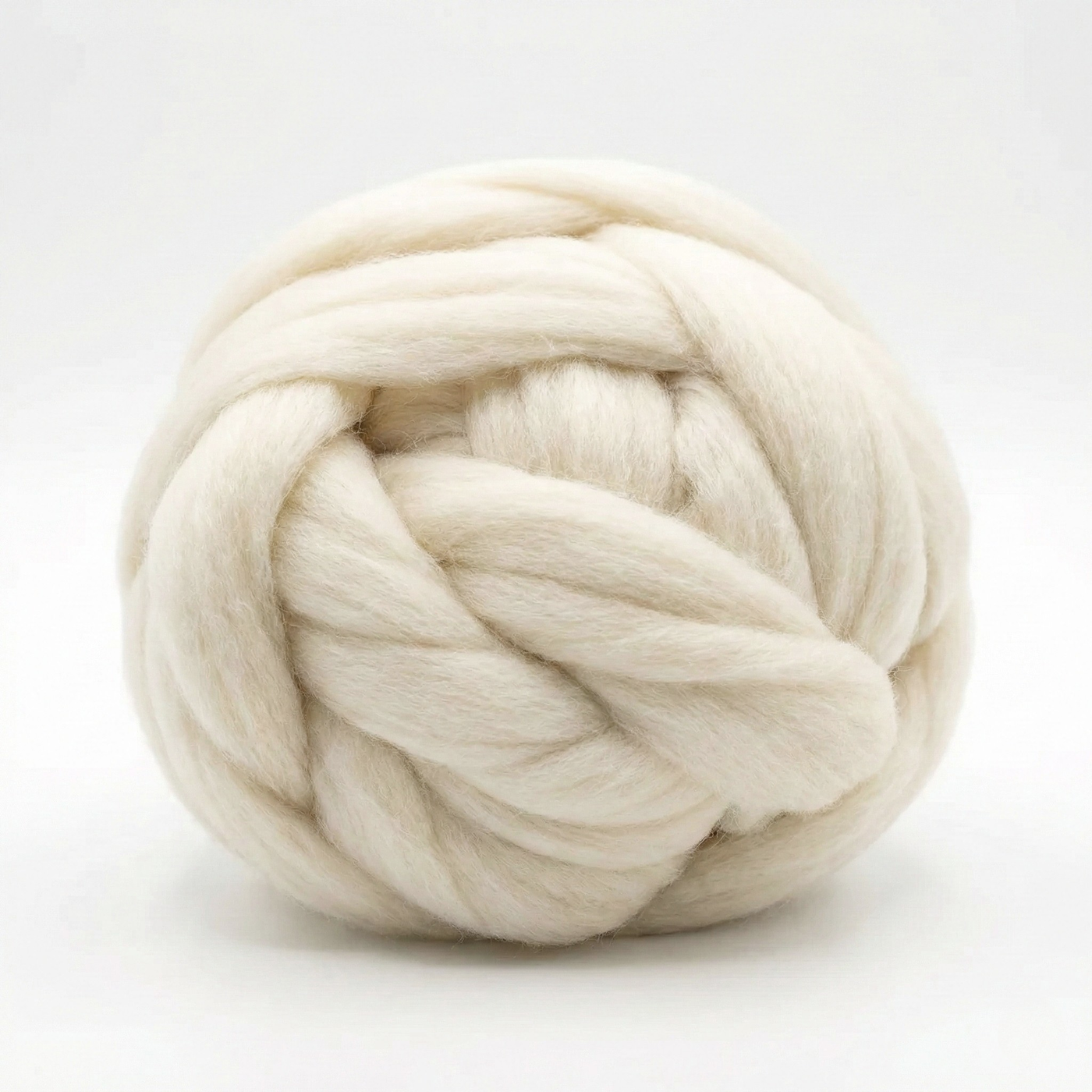 Revolution Fibers Cheviot combed wool top roving coiled ball on white background, angled to highlight loft and clean prep.