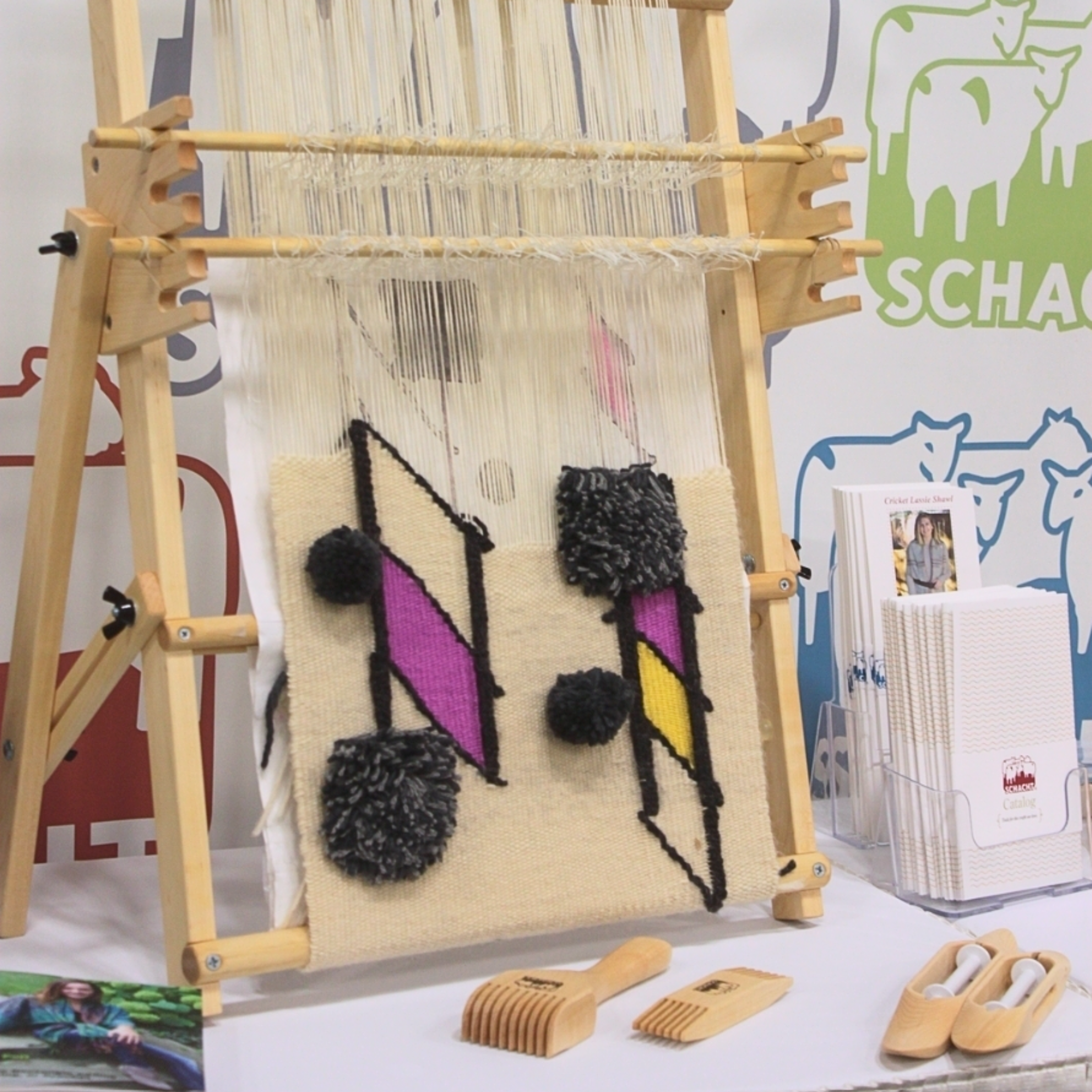 A colorful tapestry in progress on the original Schacht Tapestry Loom.